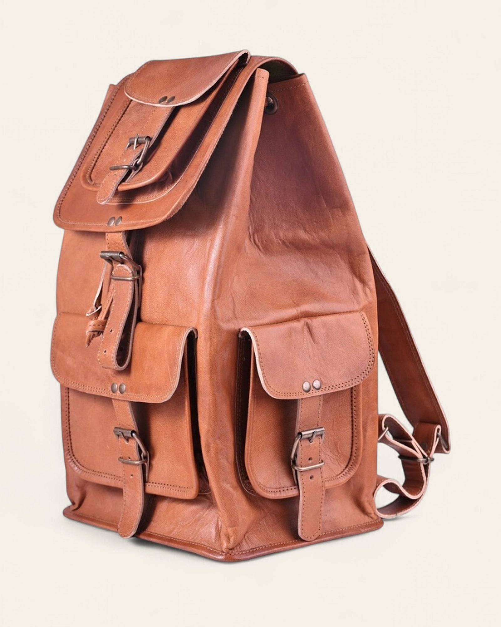 The Aravalli Backpack — angled view showing the buckled side pocket and shoulder straps