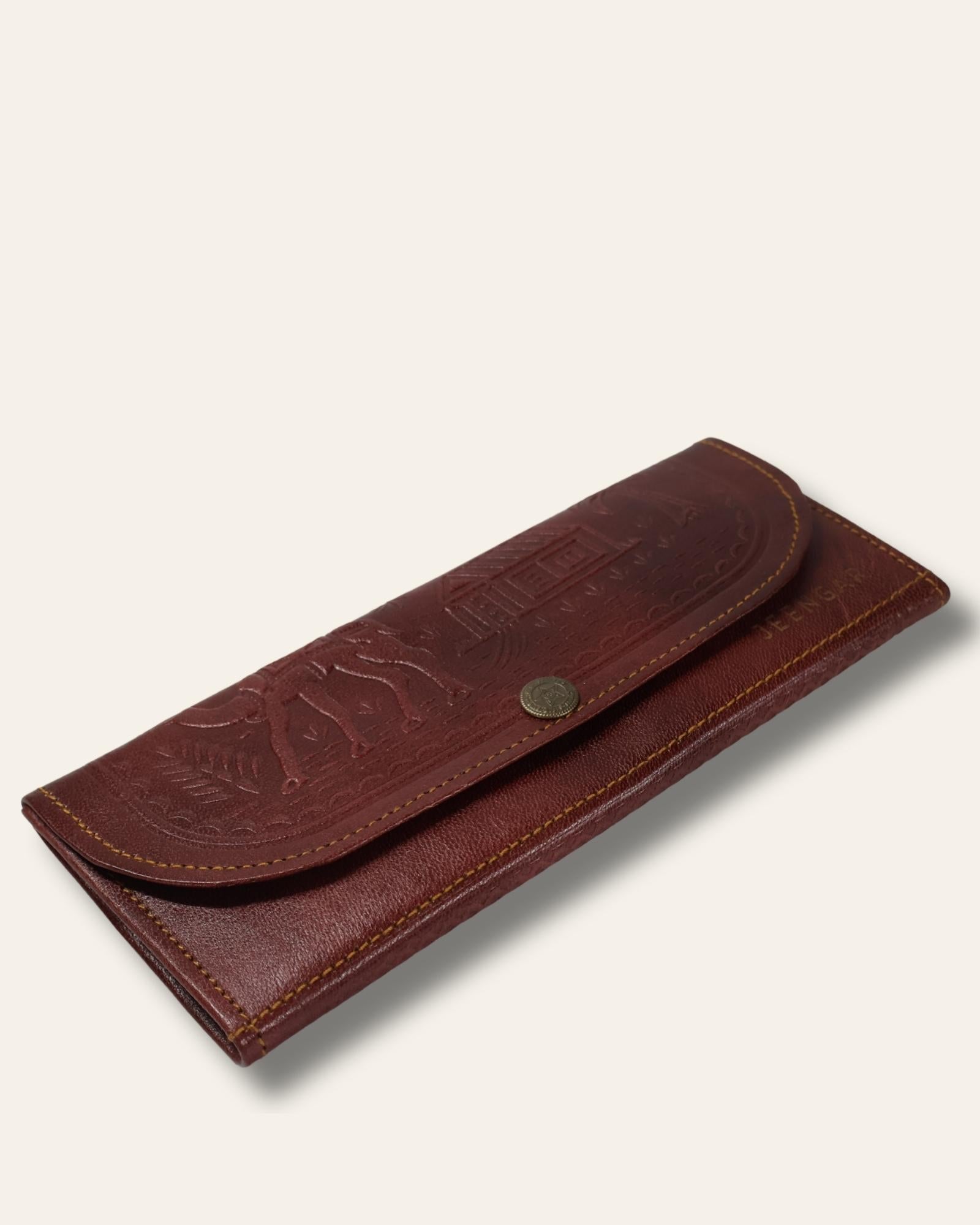 The Gangaur Clutch in Cherry — hand-embossed leather clutch, front view