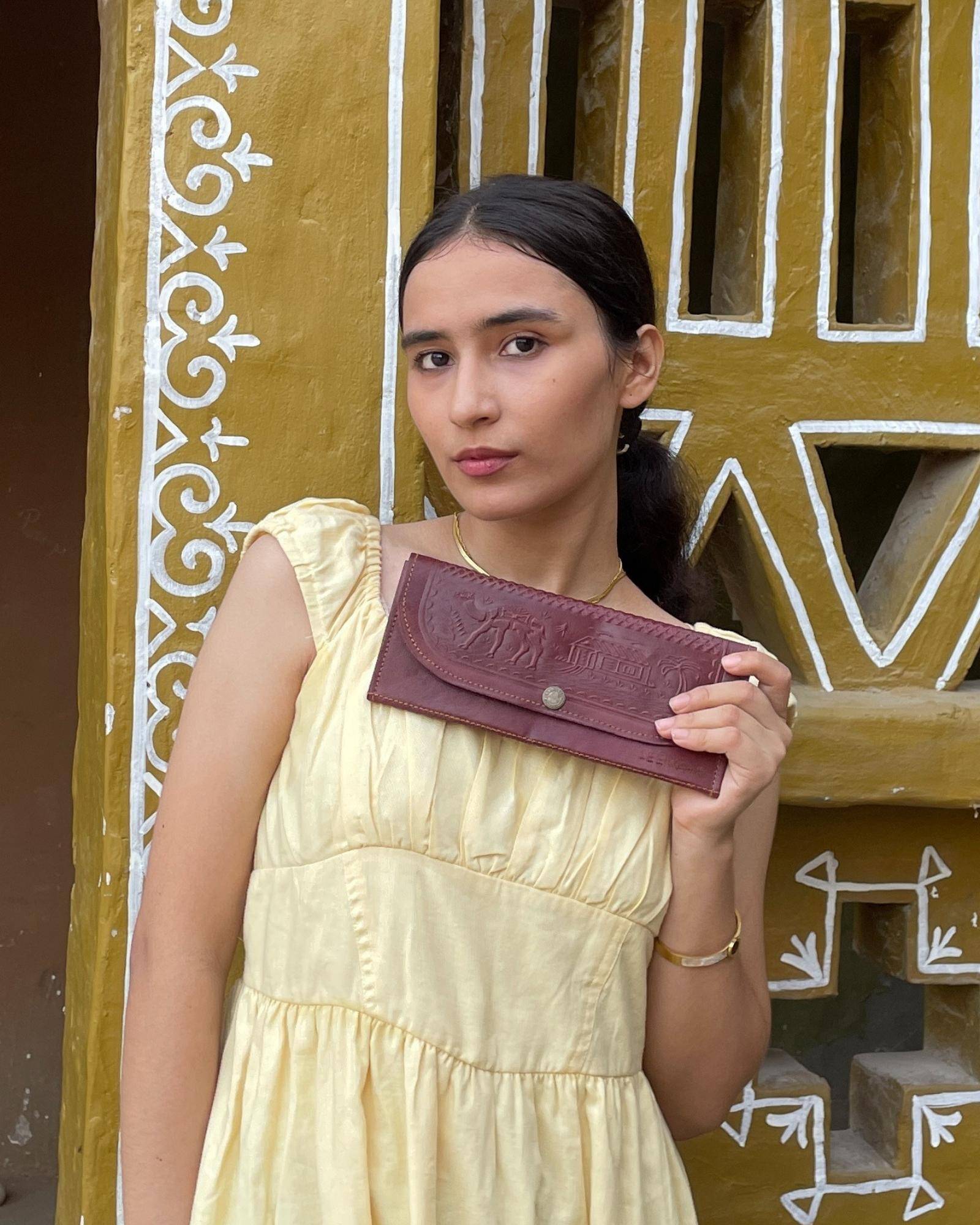 The Gangaur Clutch in Cherry — embossed camel and palm motif on real leather