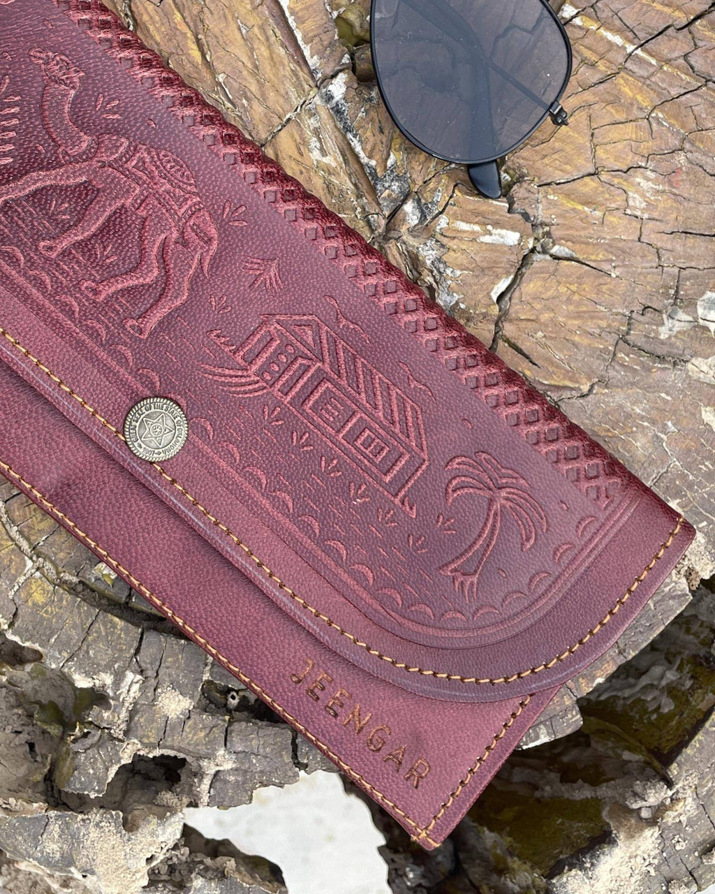 The Gangaur Clutch in Cherry — Certified Real Leather, handcrafted by artisan Mohan