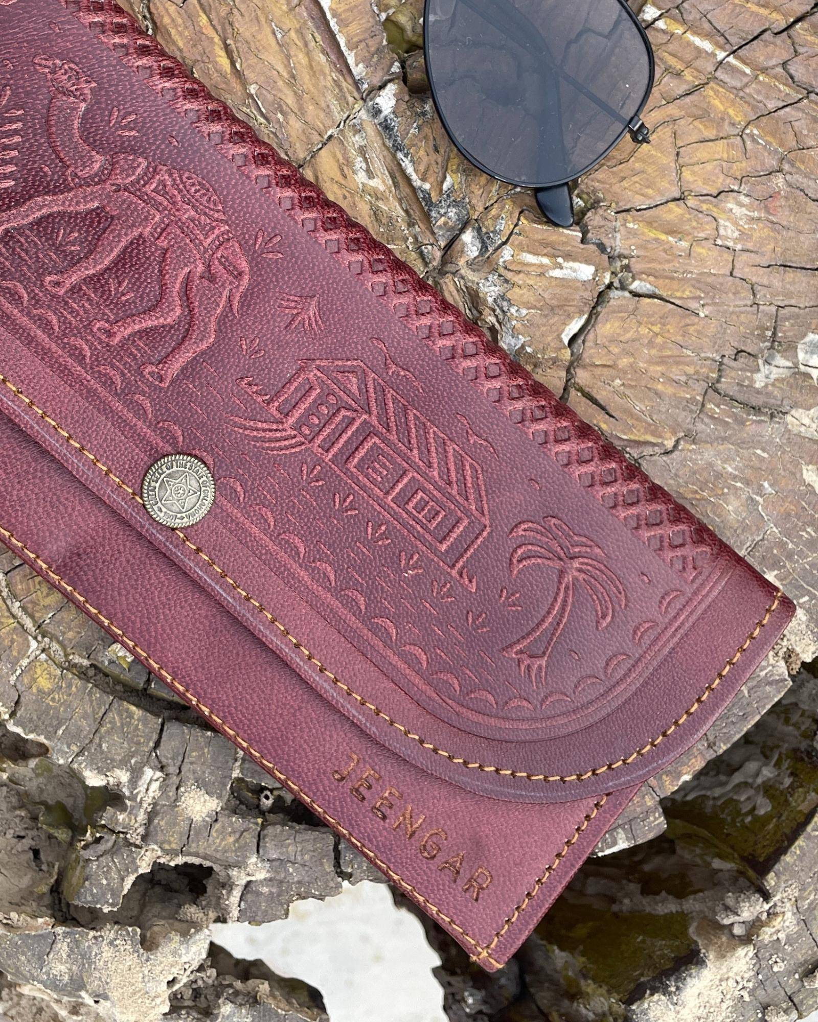 The Gangaur Clutch in Cherry — Certified Real Leather, handcrafted by artisan Mohan