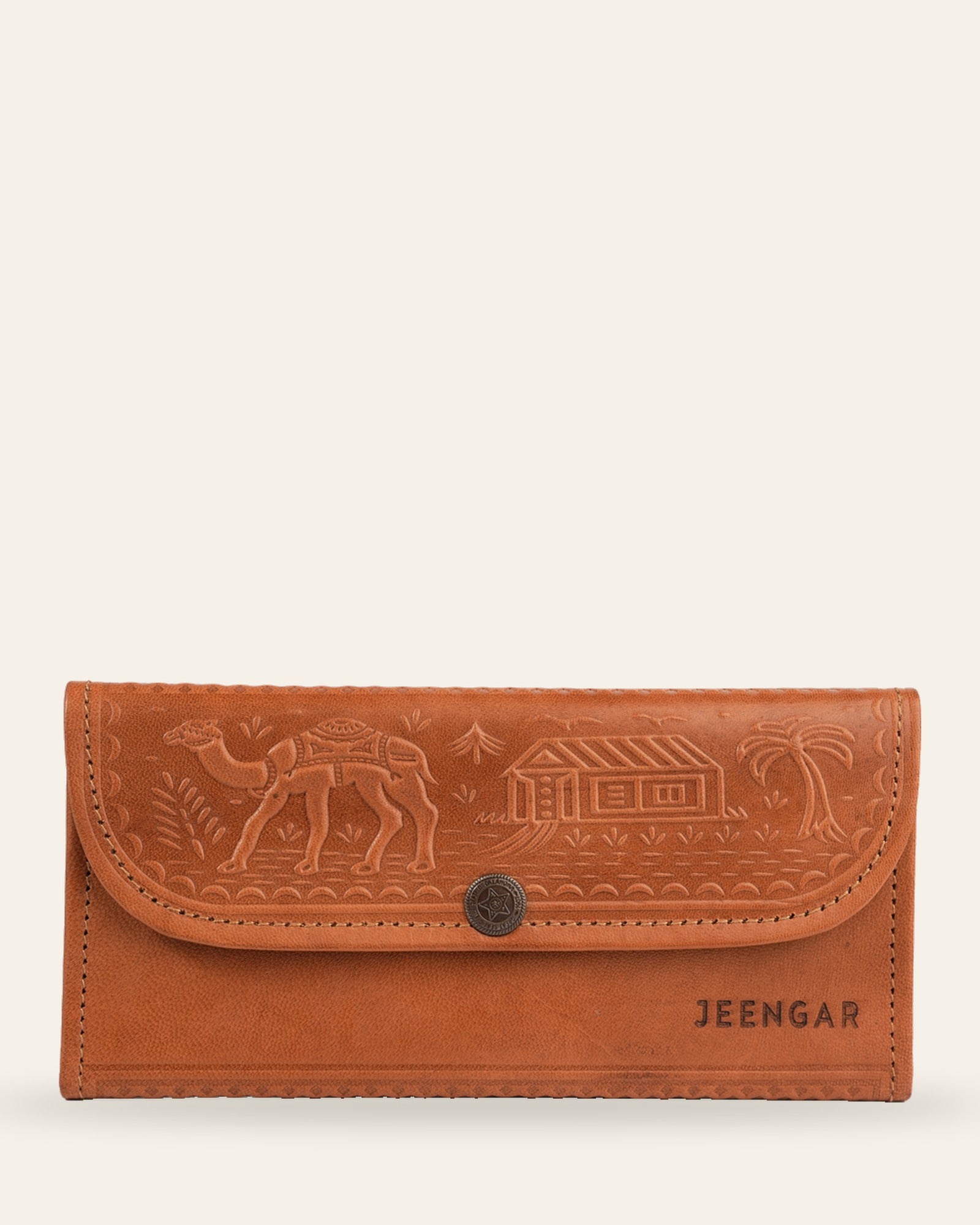 The Gangaur Clutch in Tan — hand-embossed camel and desert scene with antique concho, front view