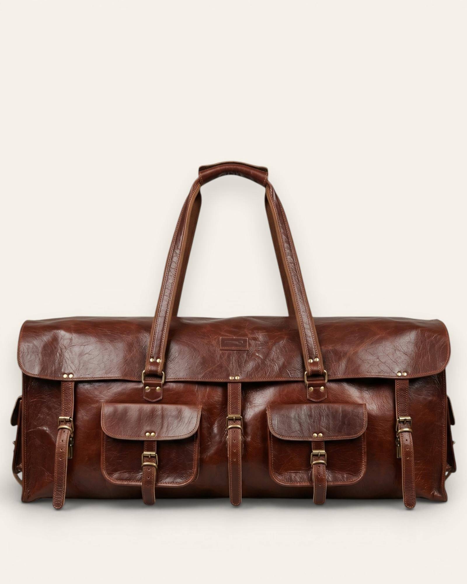 The Bikaner Cricket Holdall — handcrafted leather cricket kit bag in cherry brown, front view