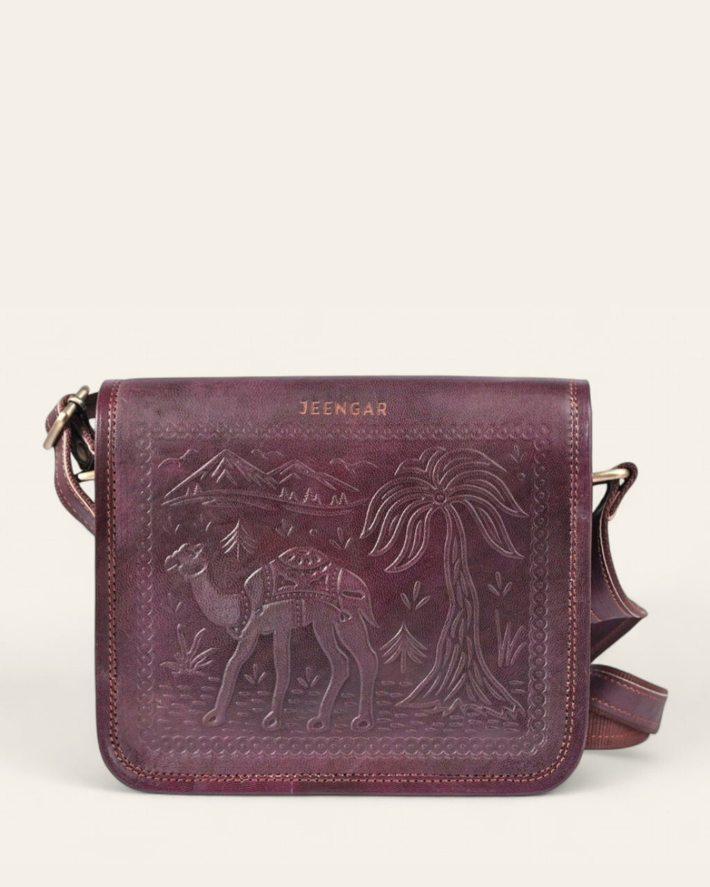 The Jaisalmer Sling in Cherry - hand-embossed camel and desert motif on Certified Real Leather, front view