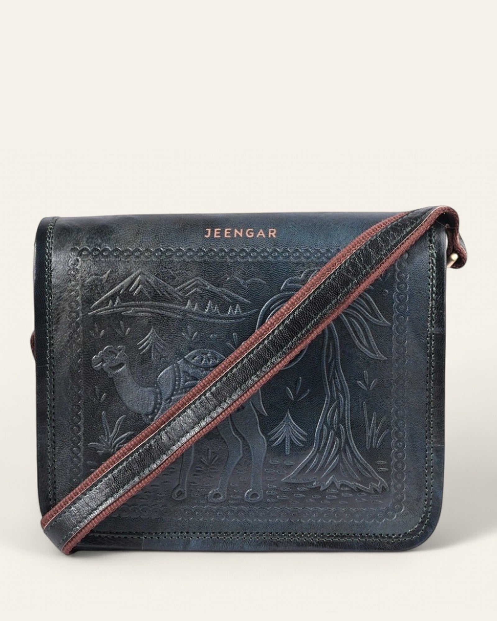 The Jaisalmer Sling in Dark Olive - hand-embossed camel and desert motif on Certified Real Leather, front view