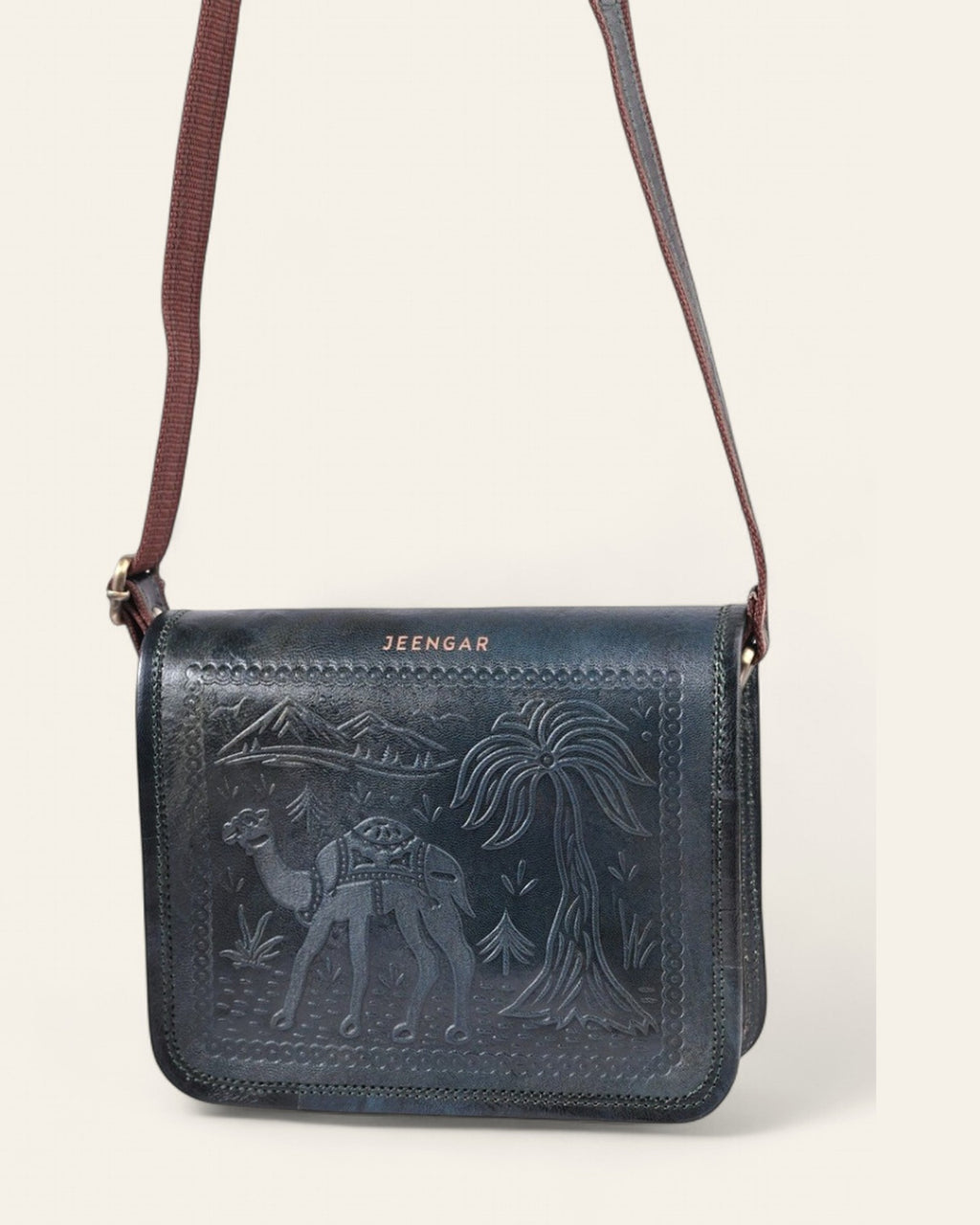 The Jaisalmer Sling in Dark Olive - hanging view with adjustable leather strap