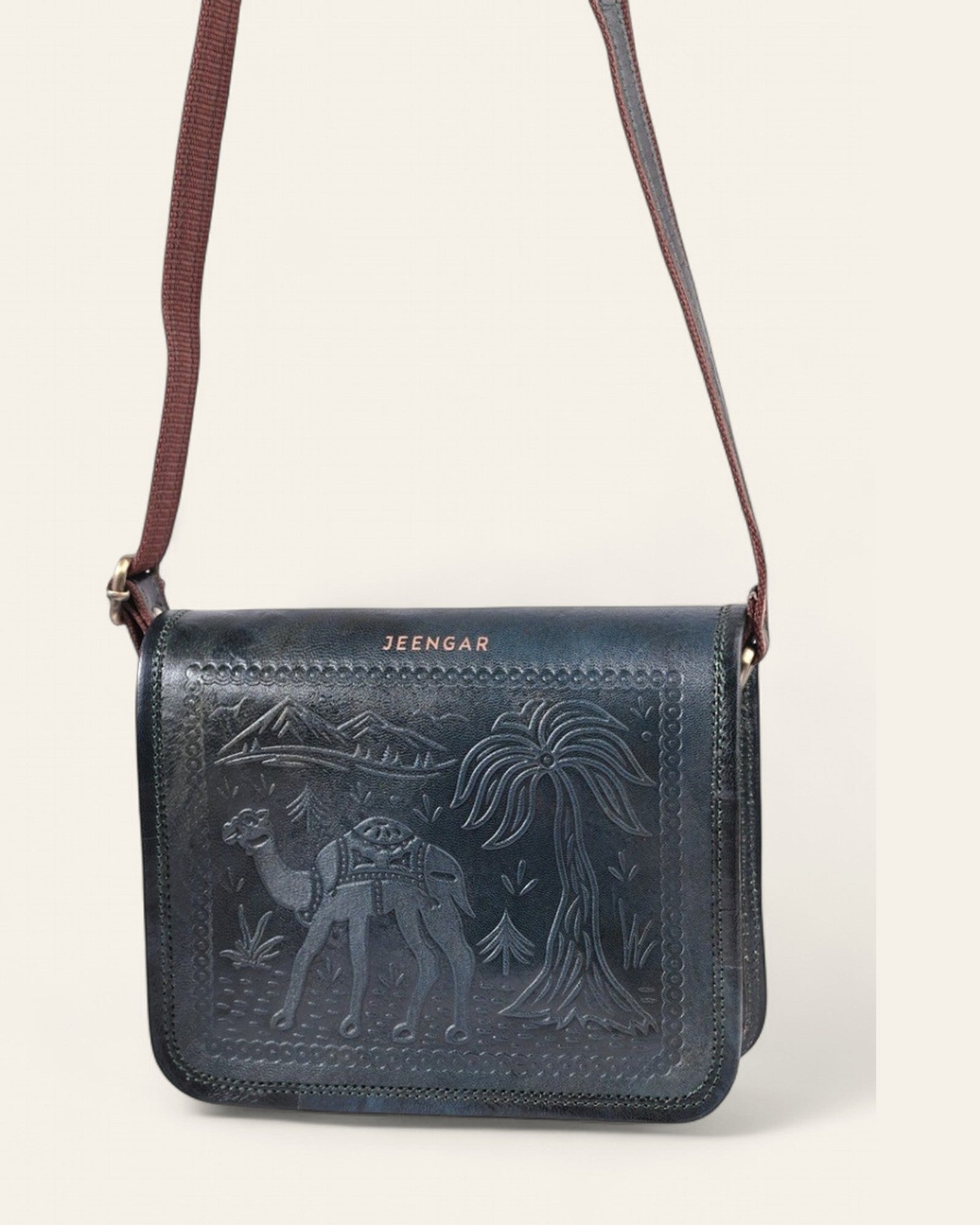 The Jaisalmer Sling in Dark Olive - hanging view with adjustable leather strap