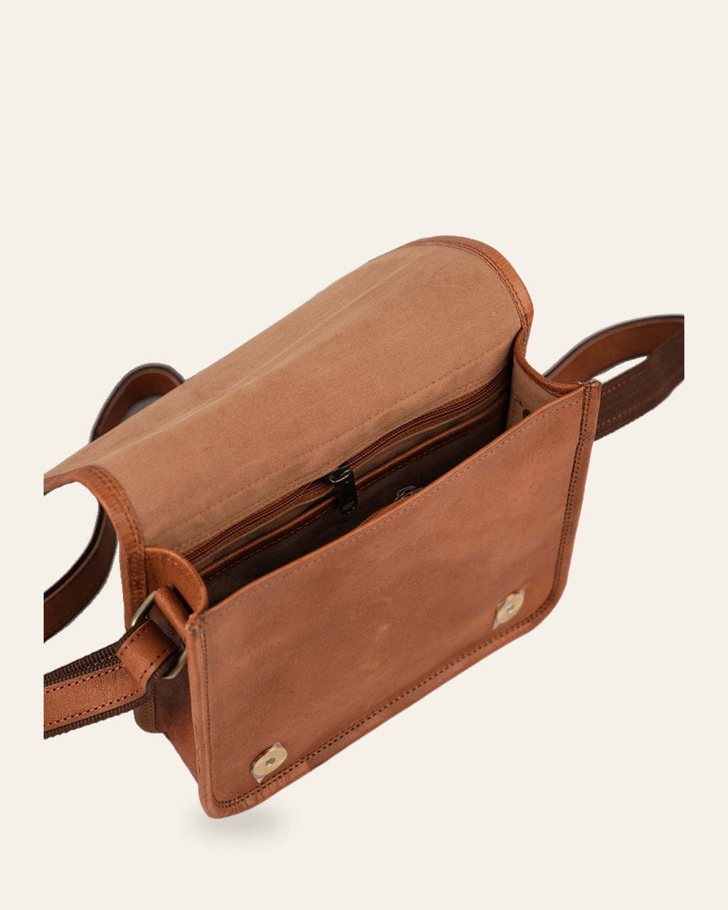 The Jaisalmer Sling in Tan — open flap showing the velvet-lined interior