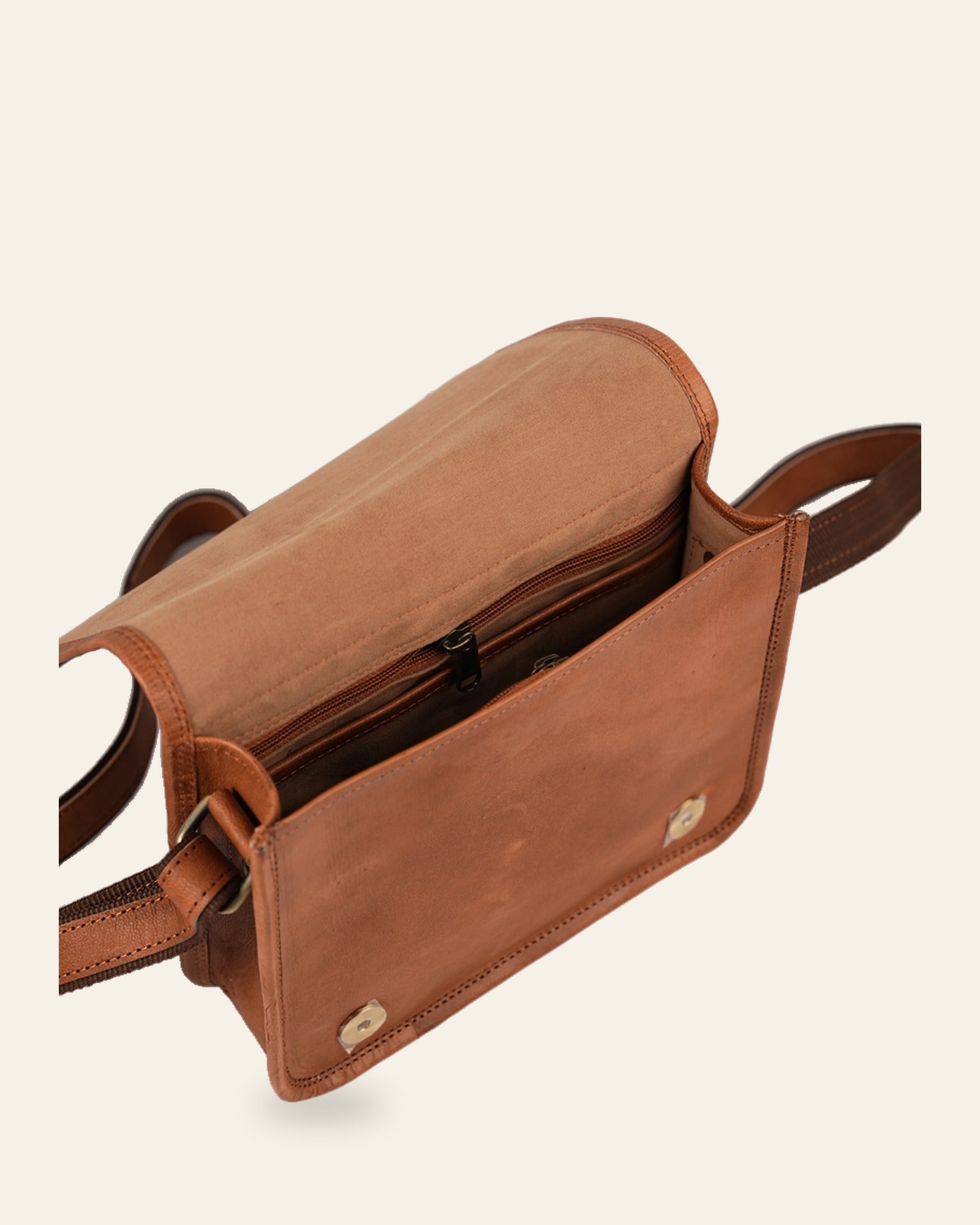 The Jaisalmer Sling in Tan — open flap showing the velvet-lined interior