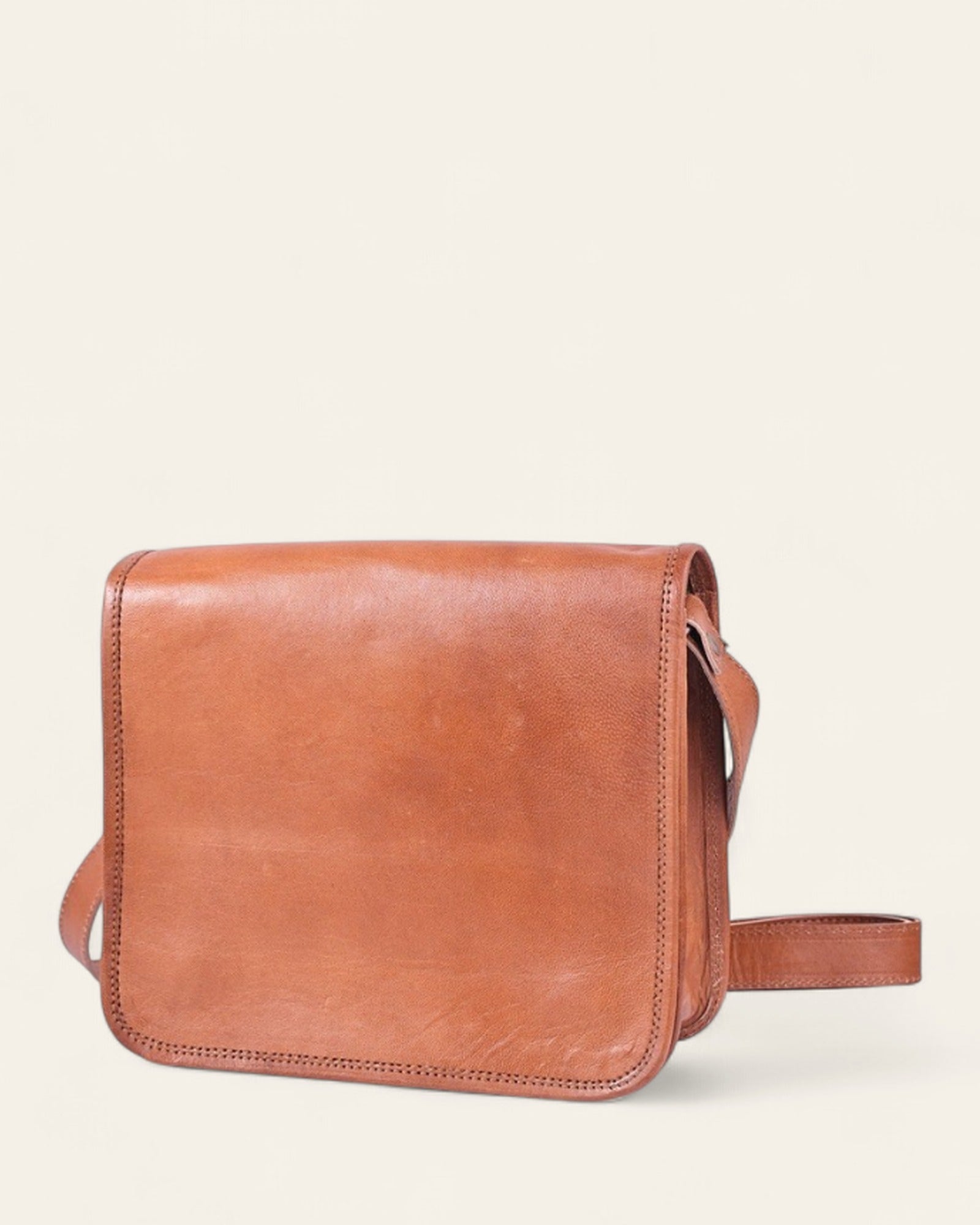 The Mandore Sling — handcrafted natural tan real leather full-flap sling by Jeengar, front view