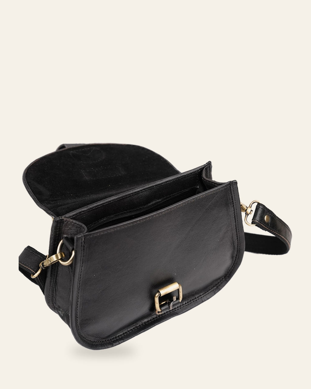 The Marwari Sling in Black — open flap showing the lined interior