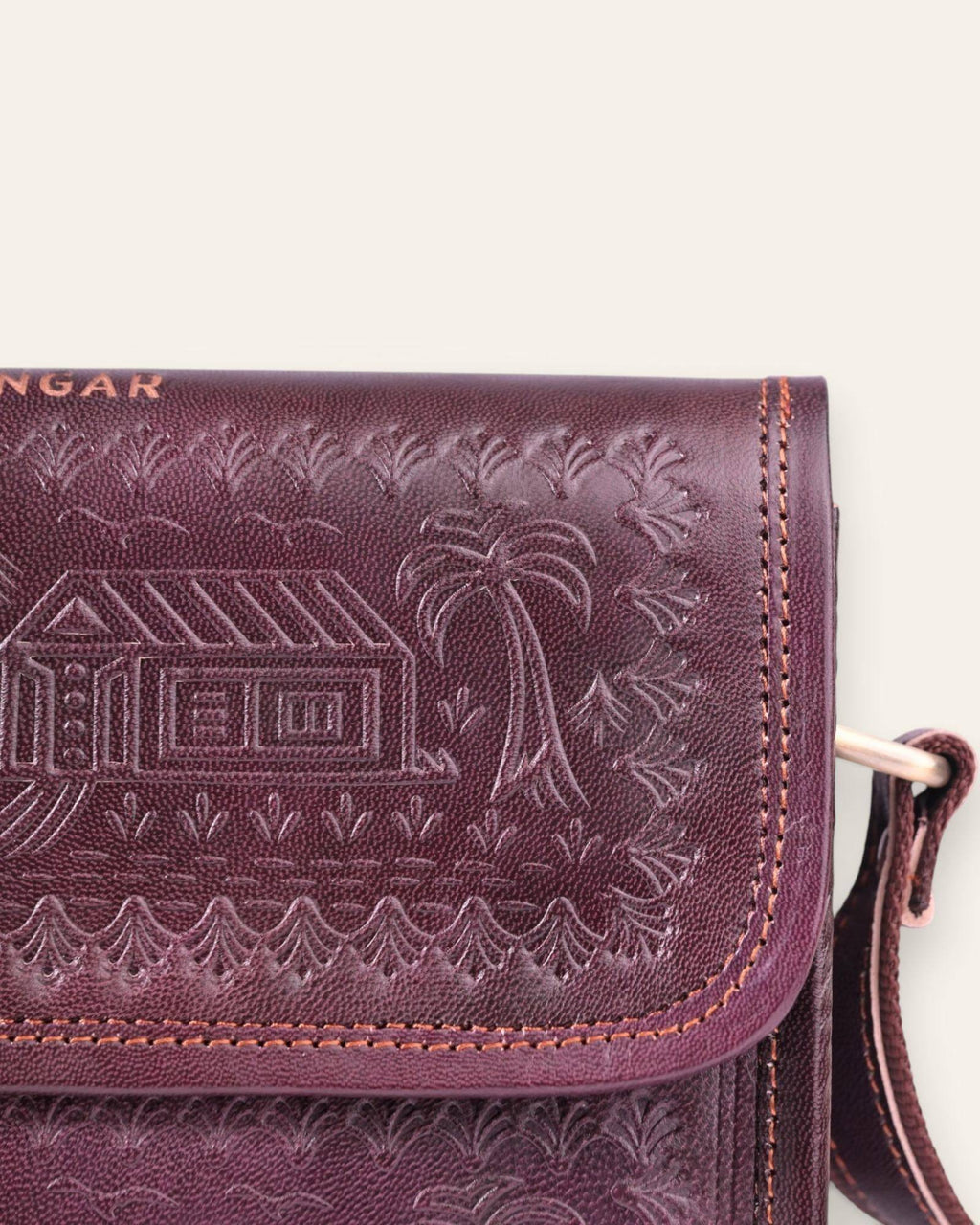 The Pushkar Sling — hand-embossed real leather sling bag with adjustable strap