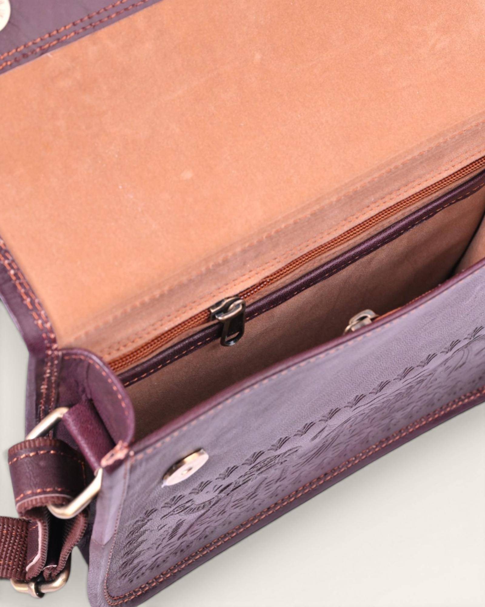 The Pushkar Sling — hand-embossed real leather sling bag held for scale