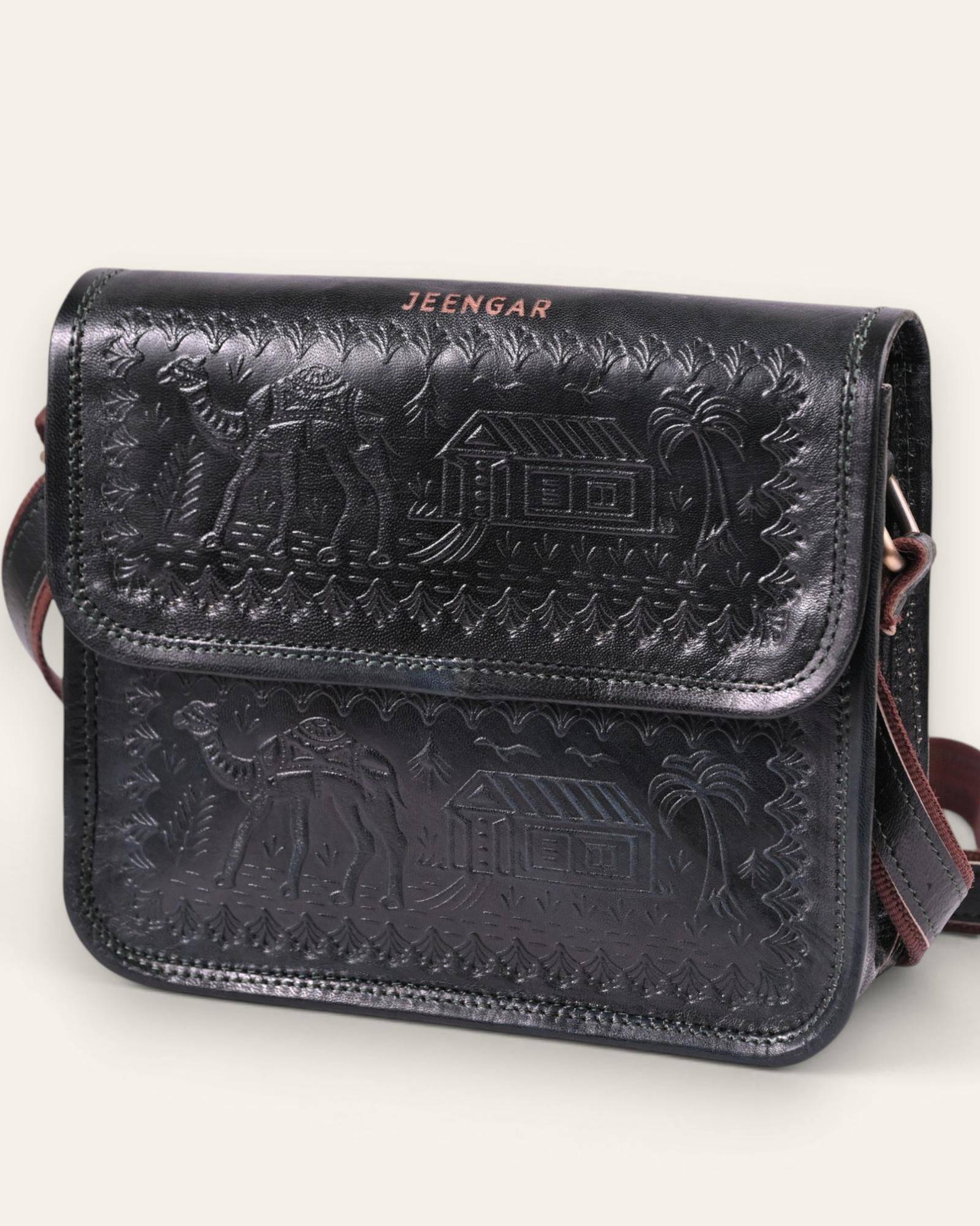 The Pushkar Sling in Dark Olive — hand-embossed camel motif on real leather, front view