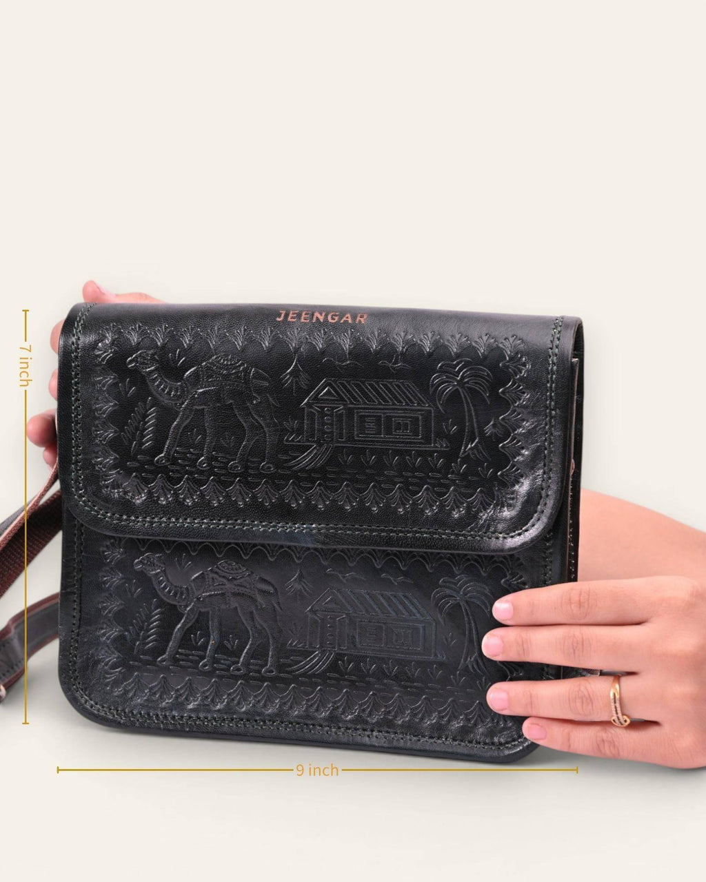 The Pushkar Sling in Dark Olive — embossed camel and desert dwelling motif
