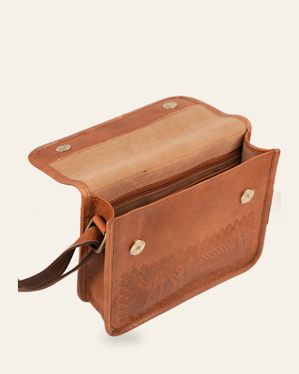 The Pushkar Sling in Tan — open flap showing the velvet-lined interior