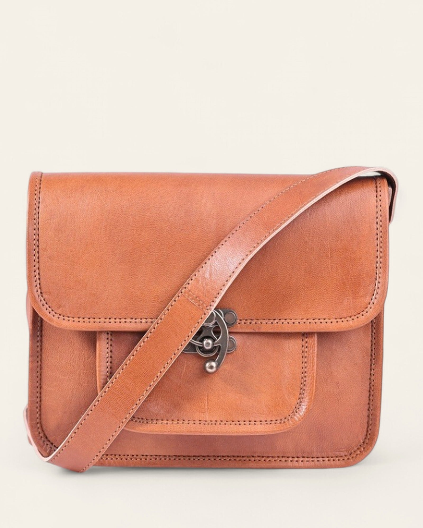 The Taragarh Satchel hanging by its adjustable crossbody strap