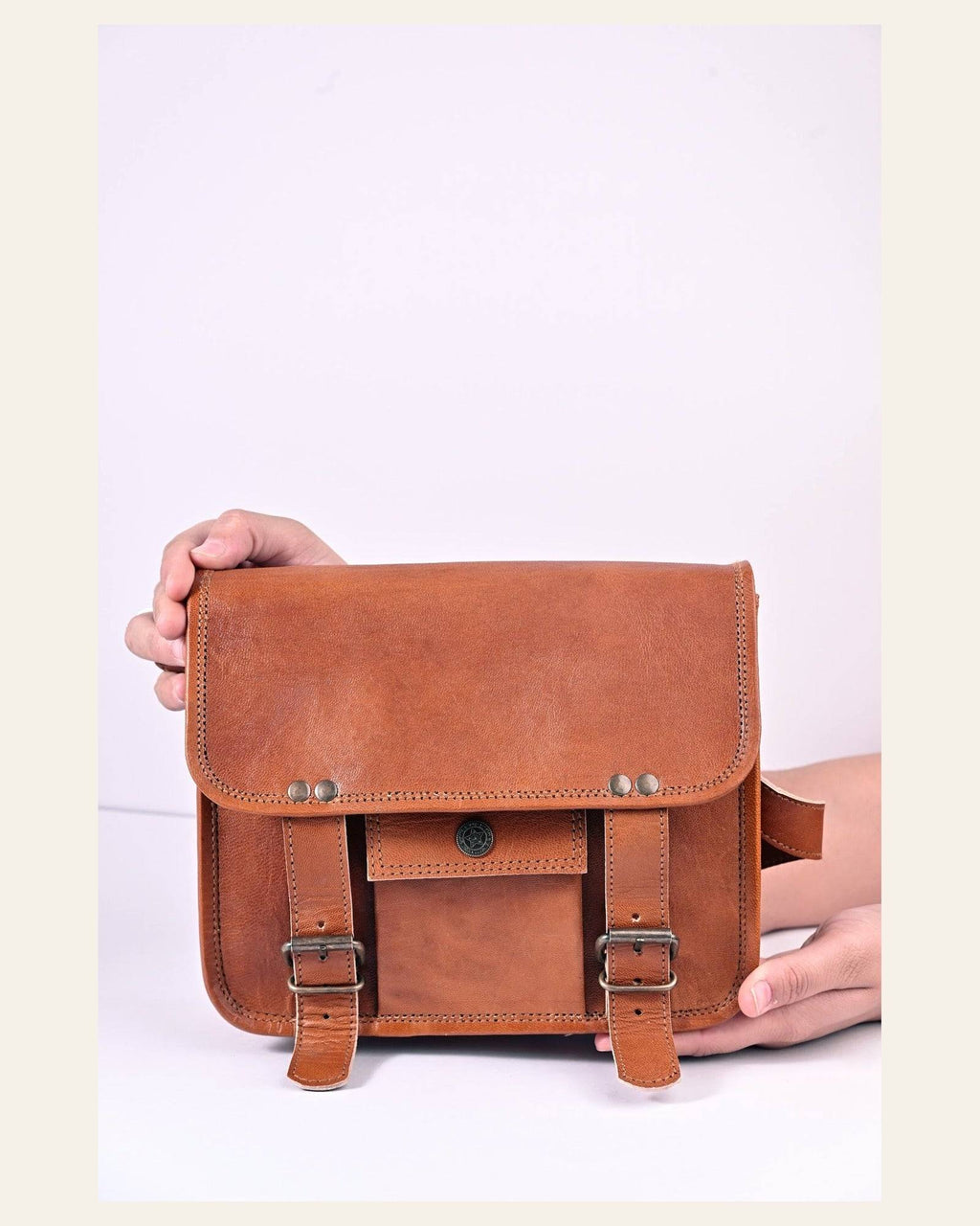 The Jaigarh Sling held in hand to show its compact everyday scale