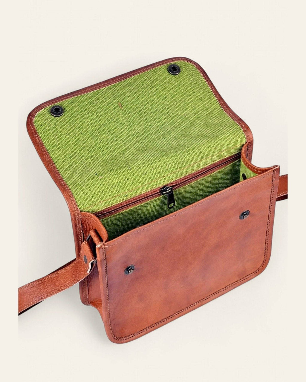 The Sojat Sling open, revealing its bright-green canvas interior
