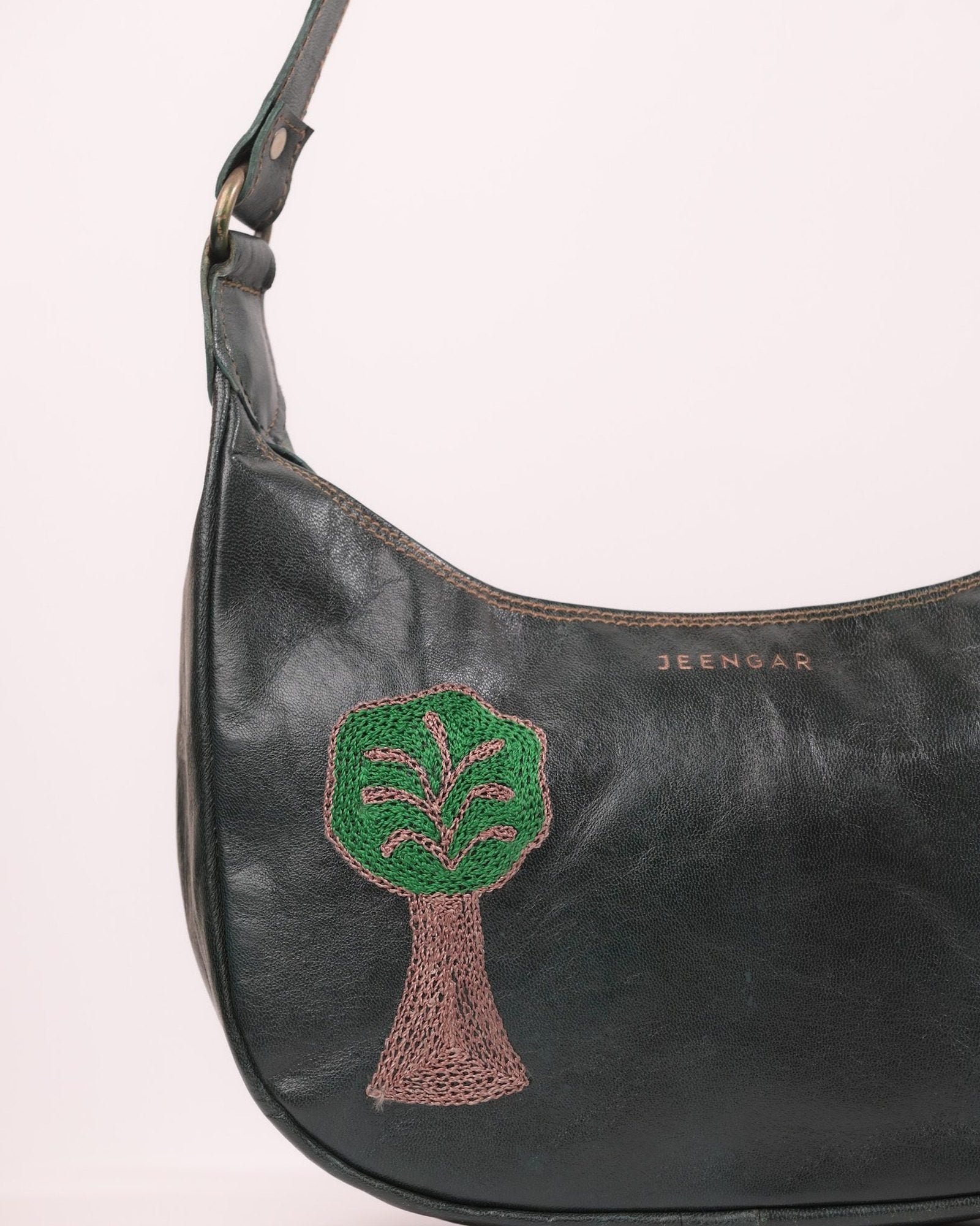 The Kashida Shoulder Bag — closeup of the hand-embroidered Padmini Tree of Life motif in Dark Olive