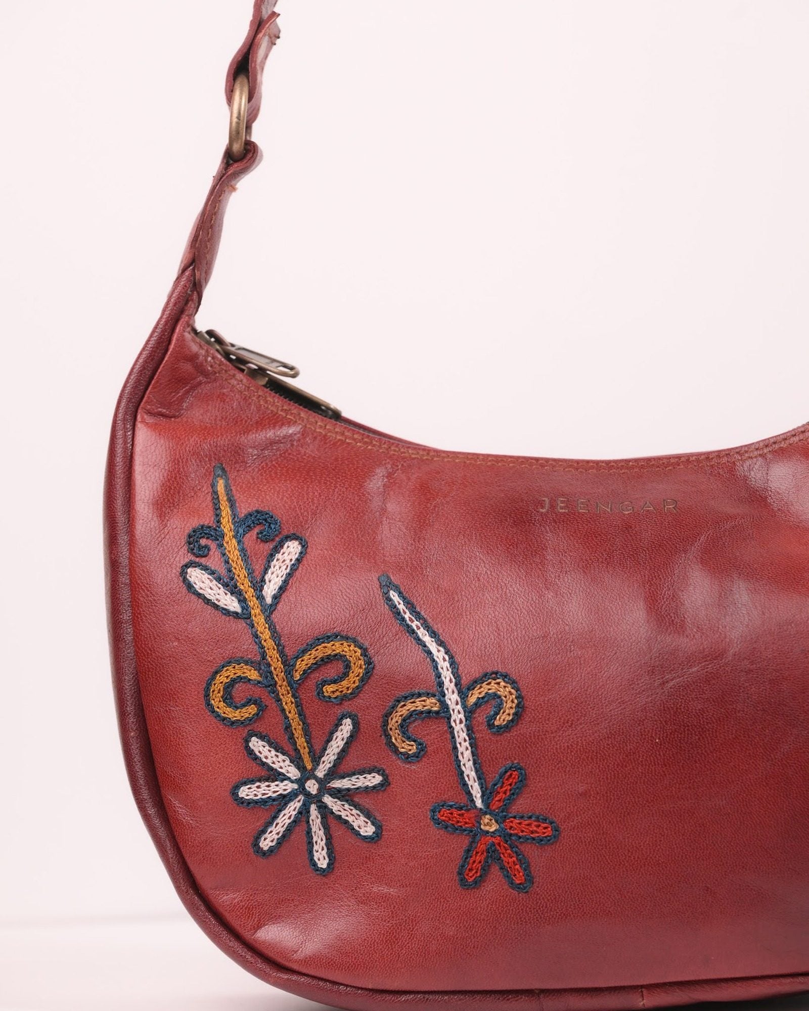 The Kashida Shoulder Bag — closeup of the hand-embroidered Mira floral motif