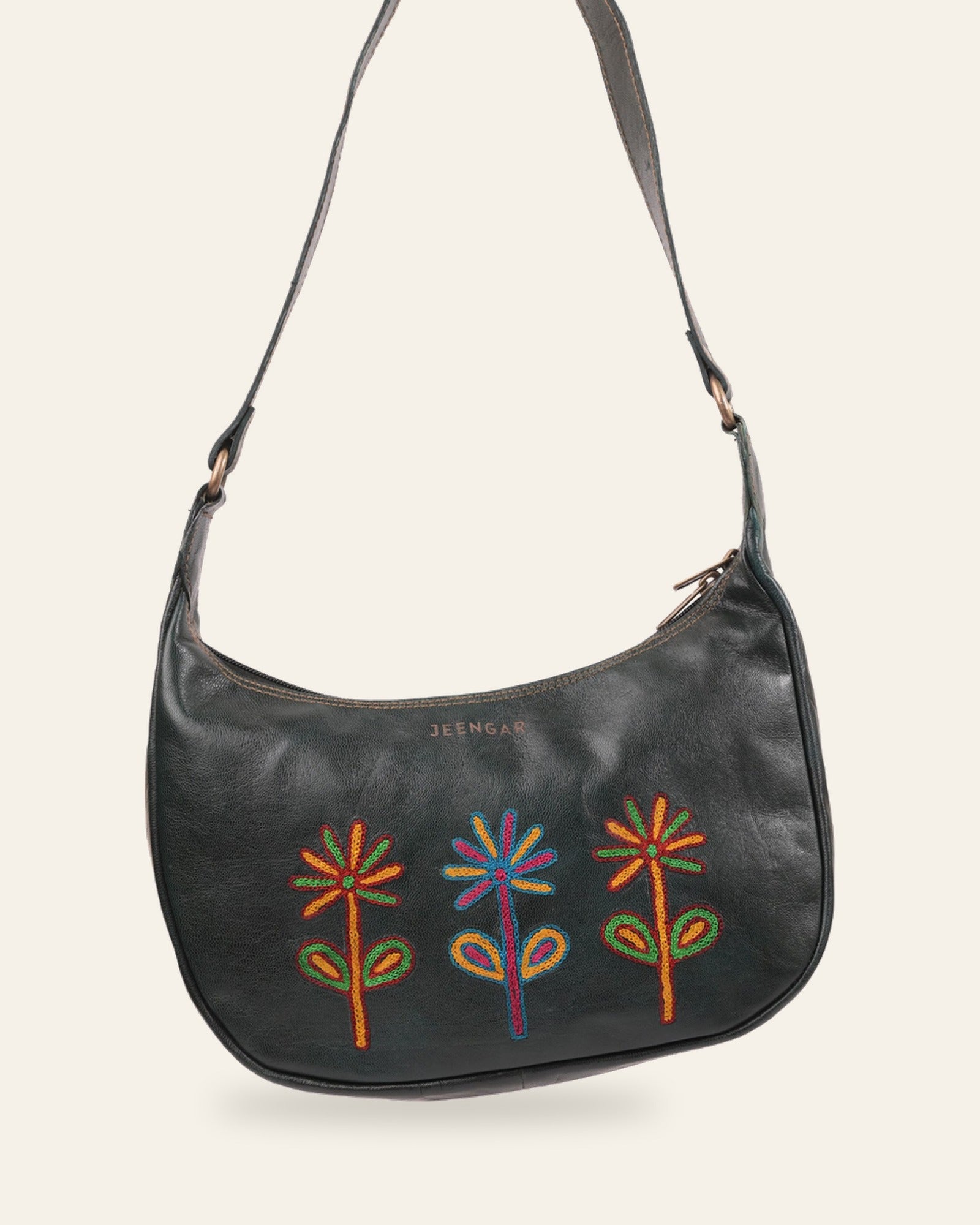 The Kashida Shoulder Bag — Sanyogita three-flower motif in Dark Olive, hand-embroidered real leather, front view