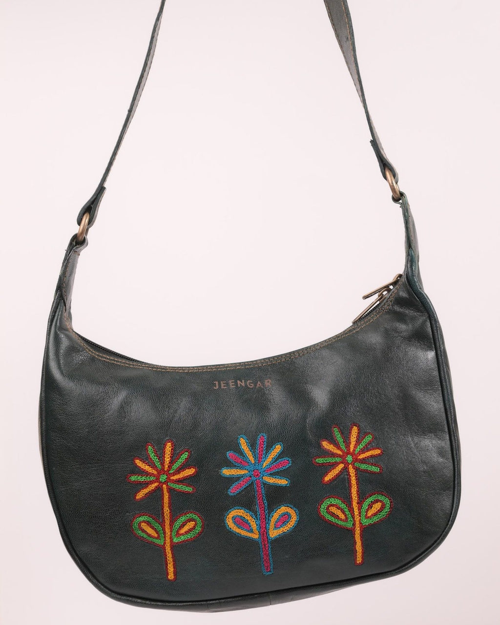 The Kashida Shoulder Bag — closeup of the hand-embroidered Sanyogita flowers in Dark Olive