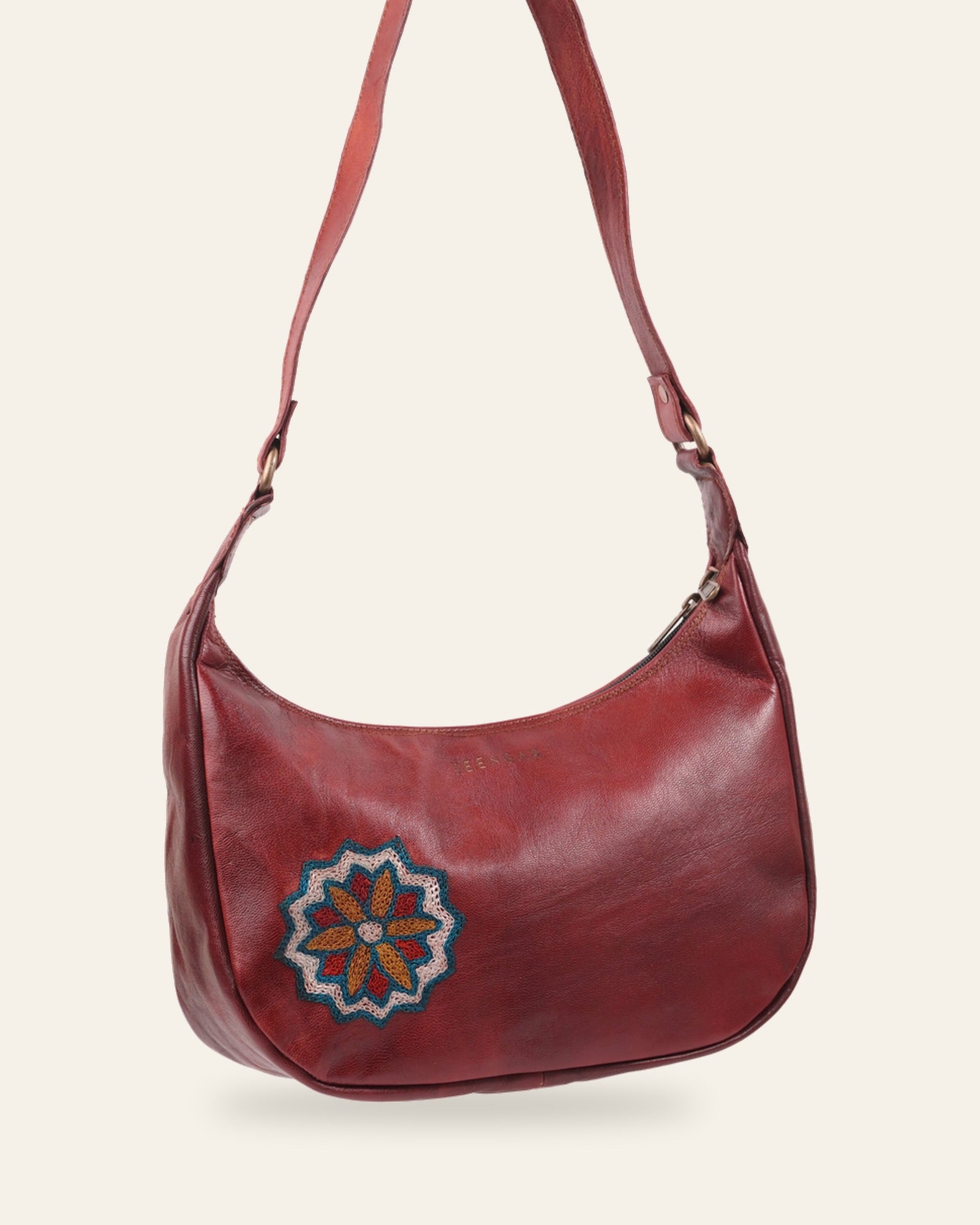 The Kashida Shoulder Bag — Hadi mandala medallion in Cherry, hand-embroidered real leather, front view