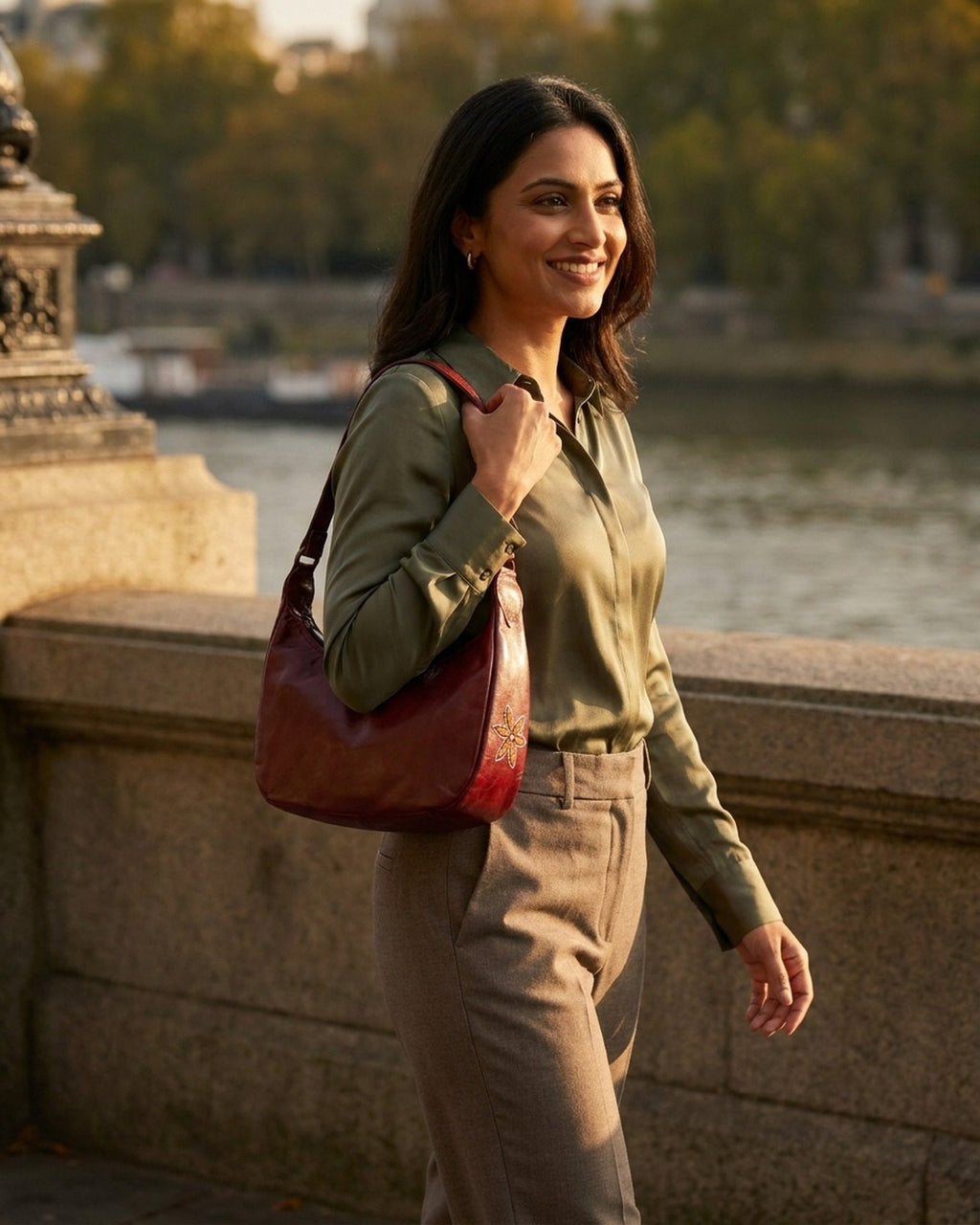 The Kashida Shoulder Bag Moomal in Cherry worn on the shoulder