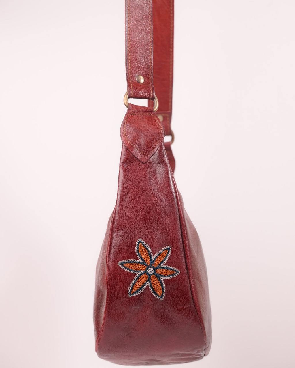 The Kashida Shoulder Bag — closeup of the hand-embroidered Moomal star flower