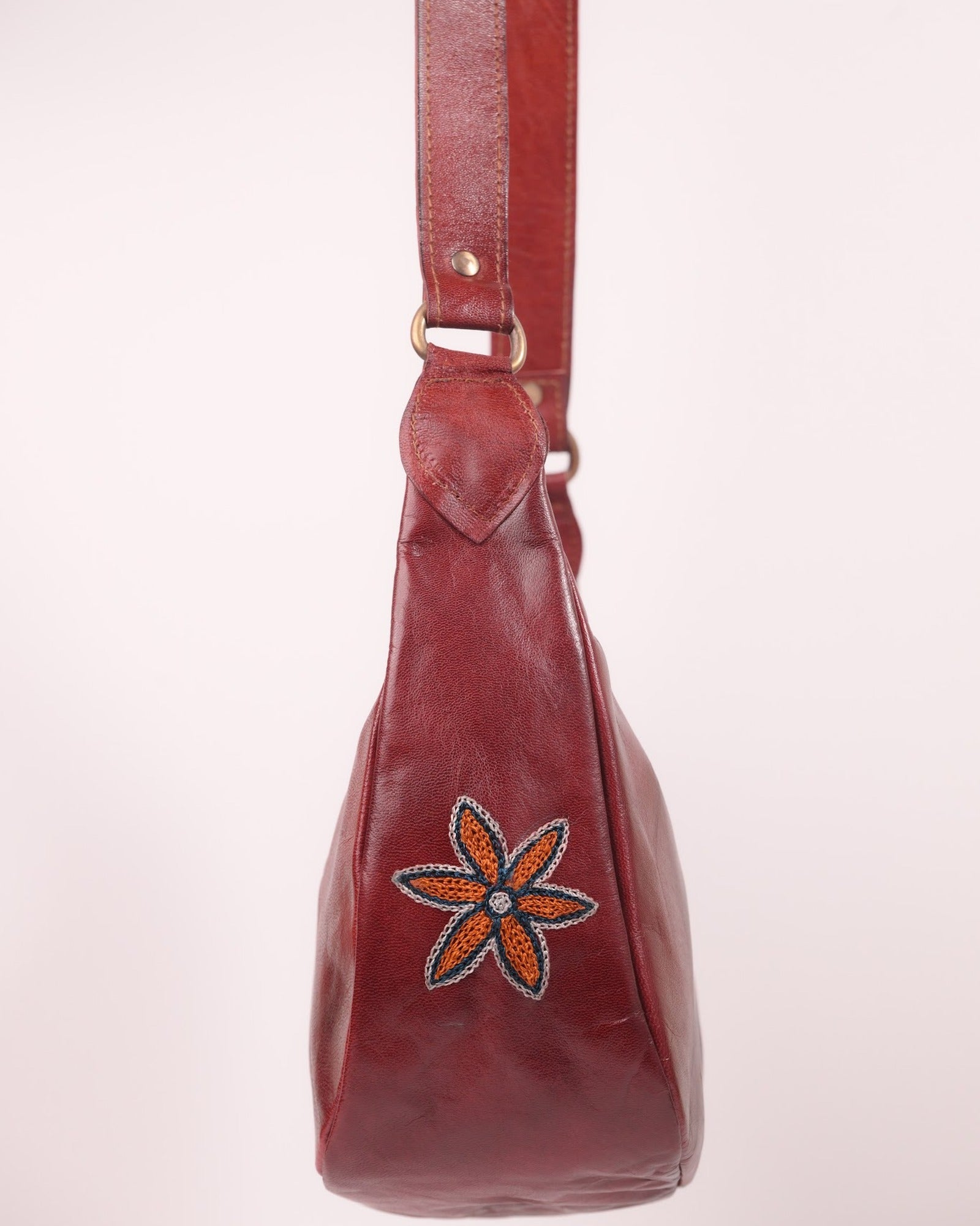 The Kashida Shoulder Bag — closeup of the hand-embroidered Moomal star flower