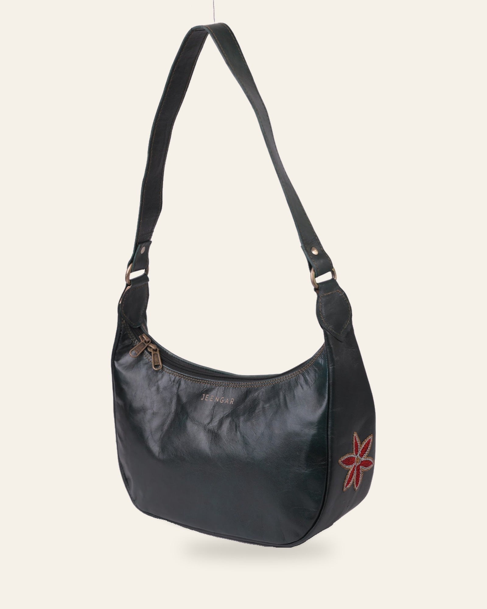 The Kashida Shoulder Bag — Moomal star-flower motif in Dark Olive, hand-embroidered real leather