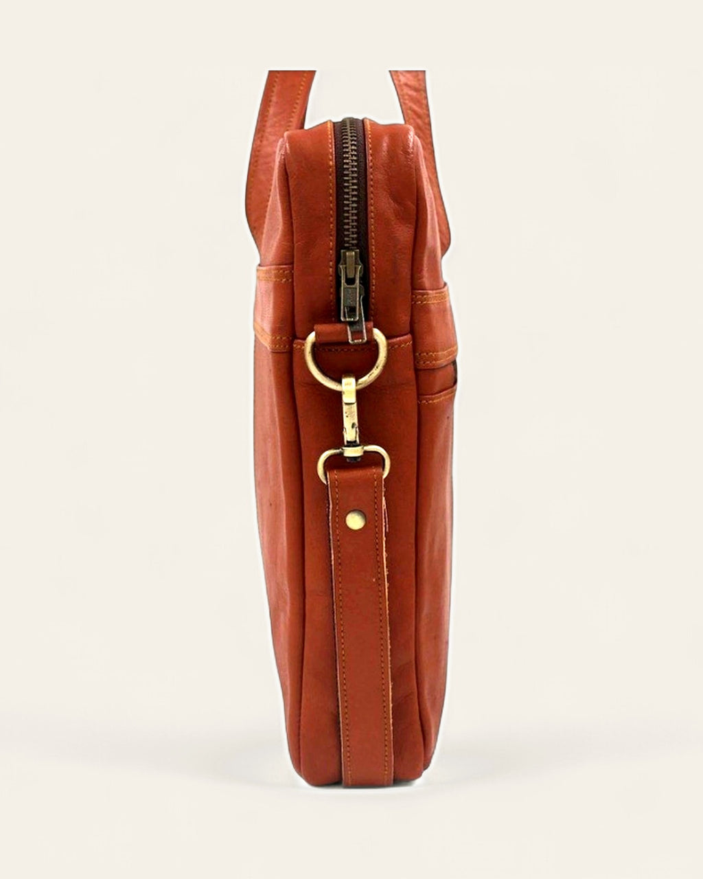 The Mehrangarh Briefcase — slim side profile with antique-brass hardware