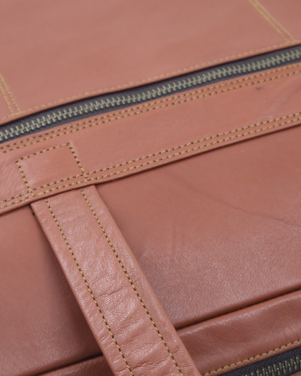 The Mehrangarh Briefcase — hand-stitched leather detail