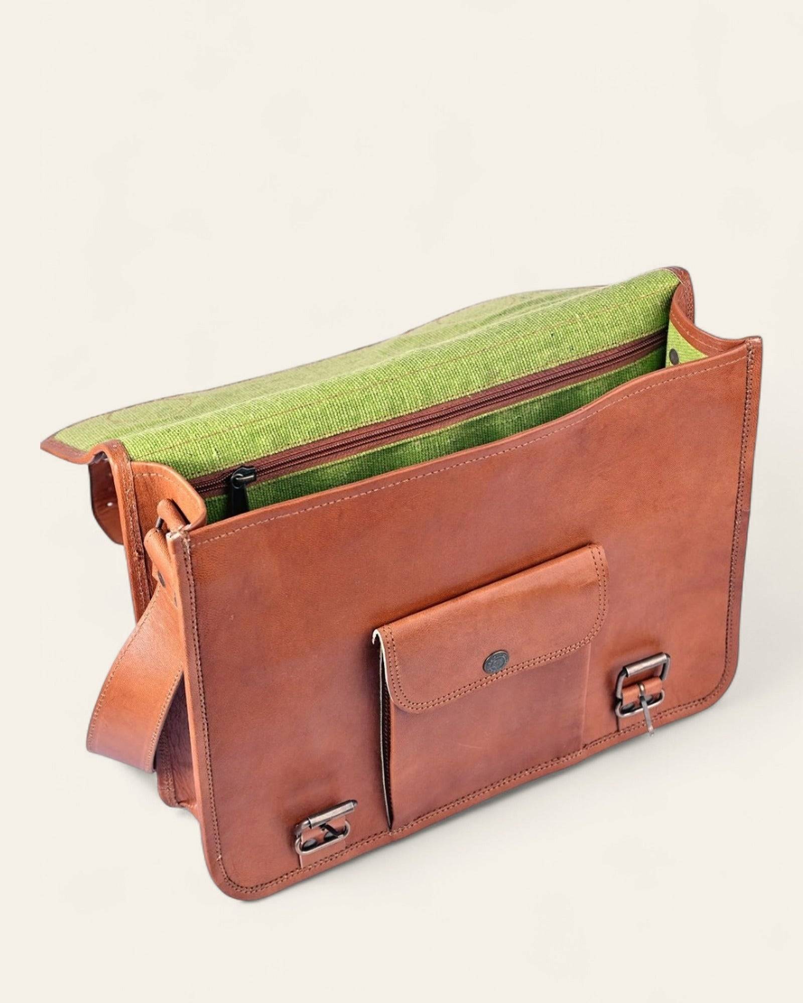 The Jaipur Laptop Bag open, revealing its bright-green canvas interior and laptop compartment