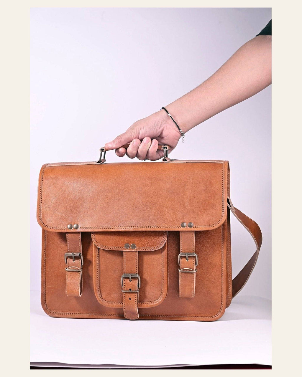 The Mewad Messenger carried by its top handle to show scale