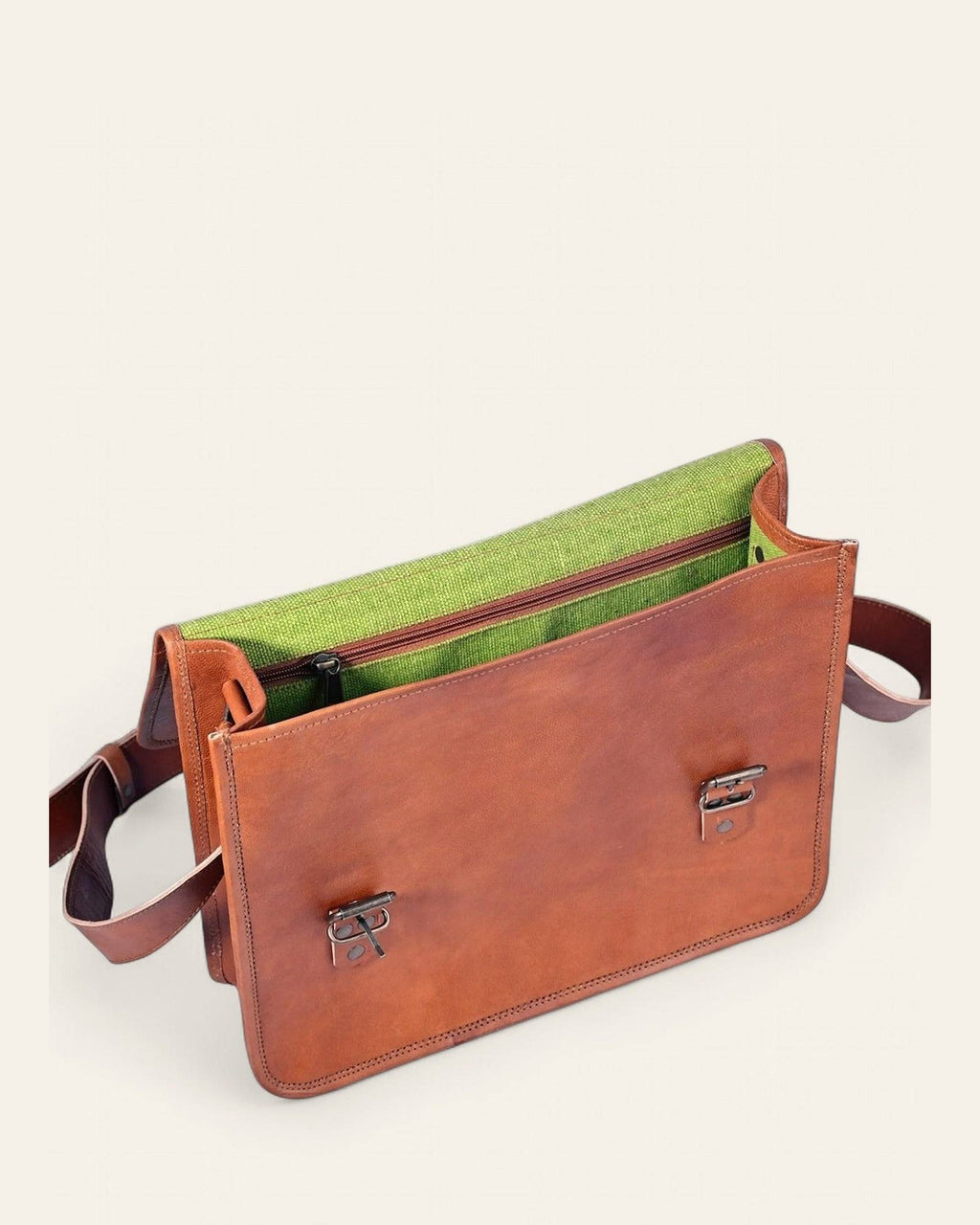The Ajmer Laptop Bag open, revealing its bright-green canvas interior and laptop compartment