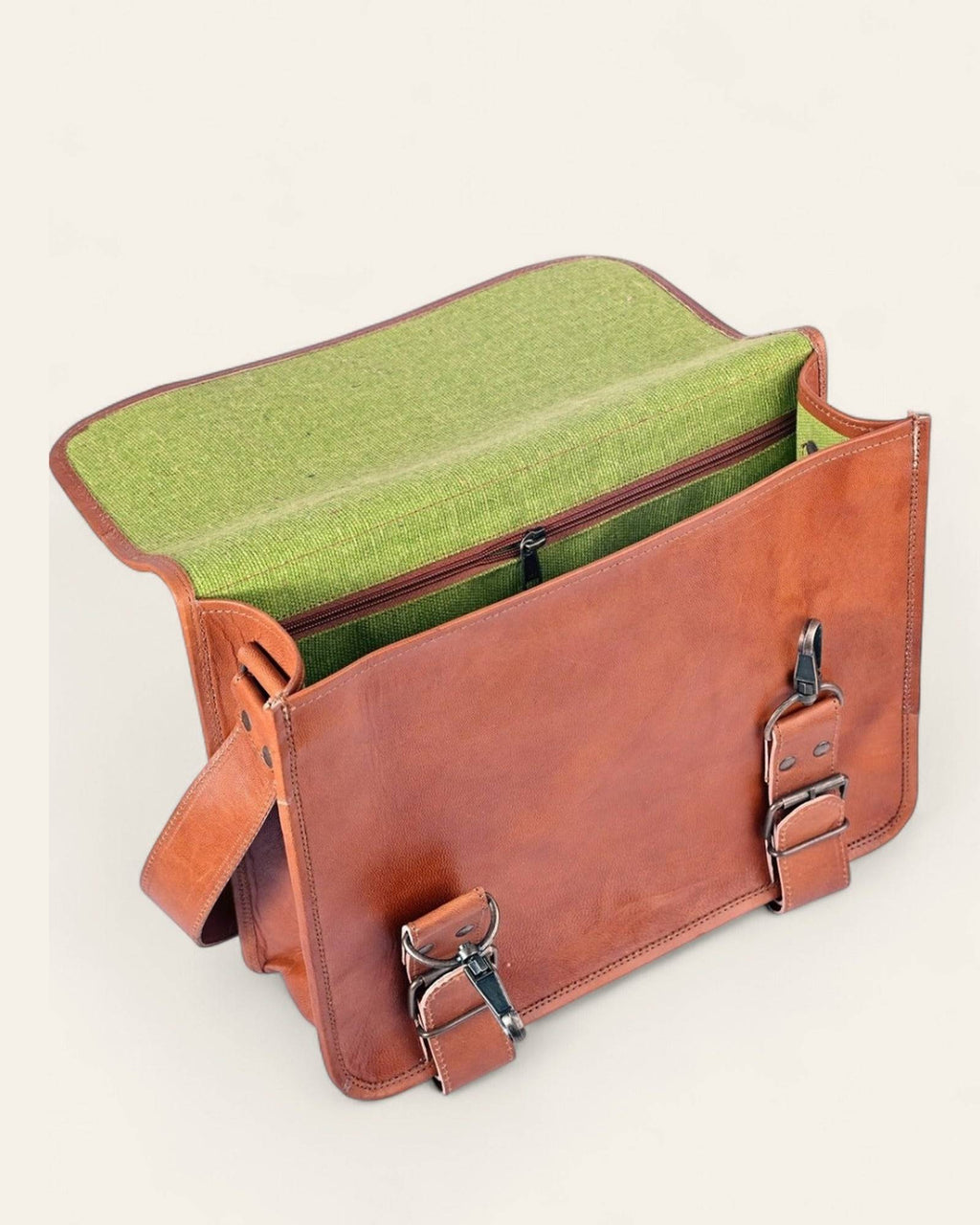 The Mangla Laptop Bag open, revealing its bright-green canvas interior