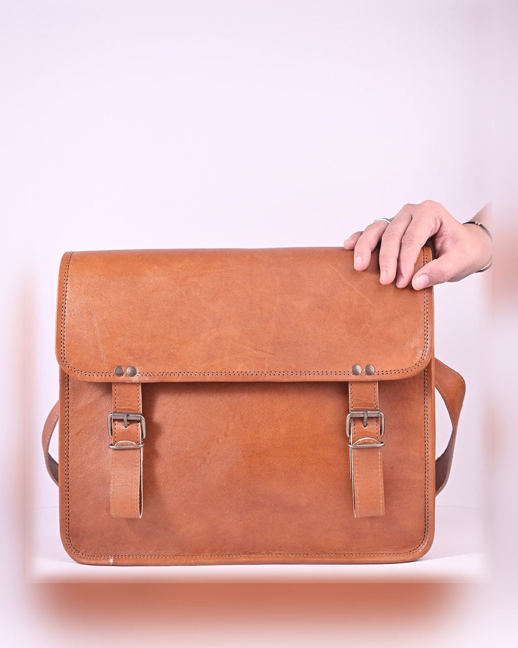 The Umaid Briefcase 15-16 in held in hand — executive scale