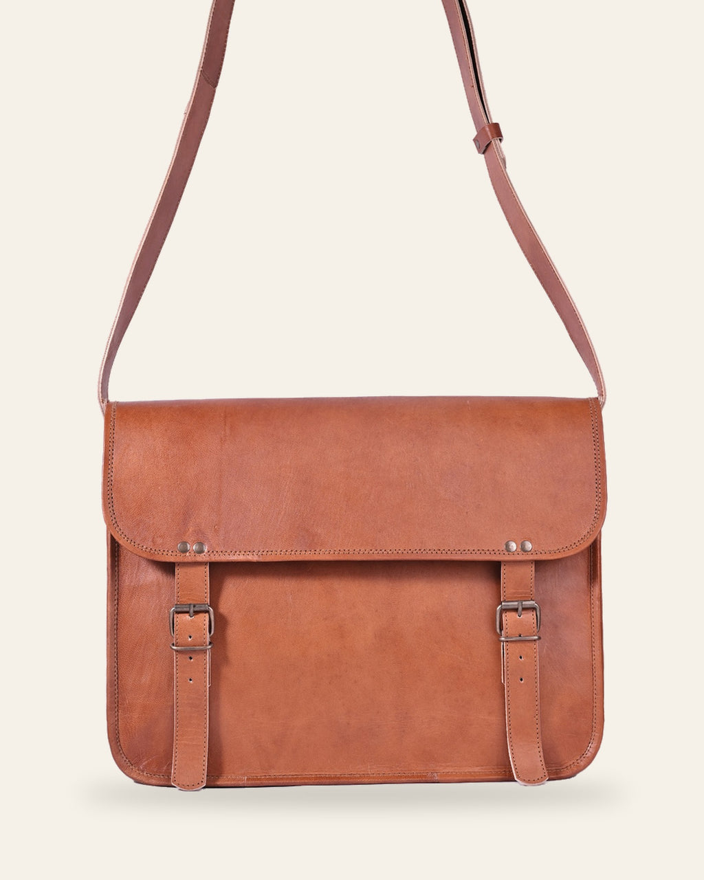 The Umaid Briefcase 13-14 in — handcrafted tan real leather laptop briefcase with twin buckle straps, front view