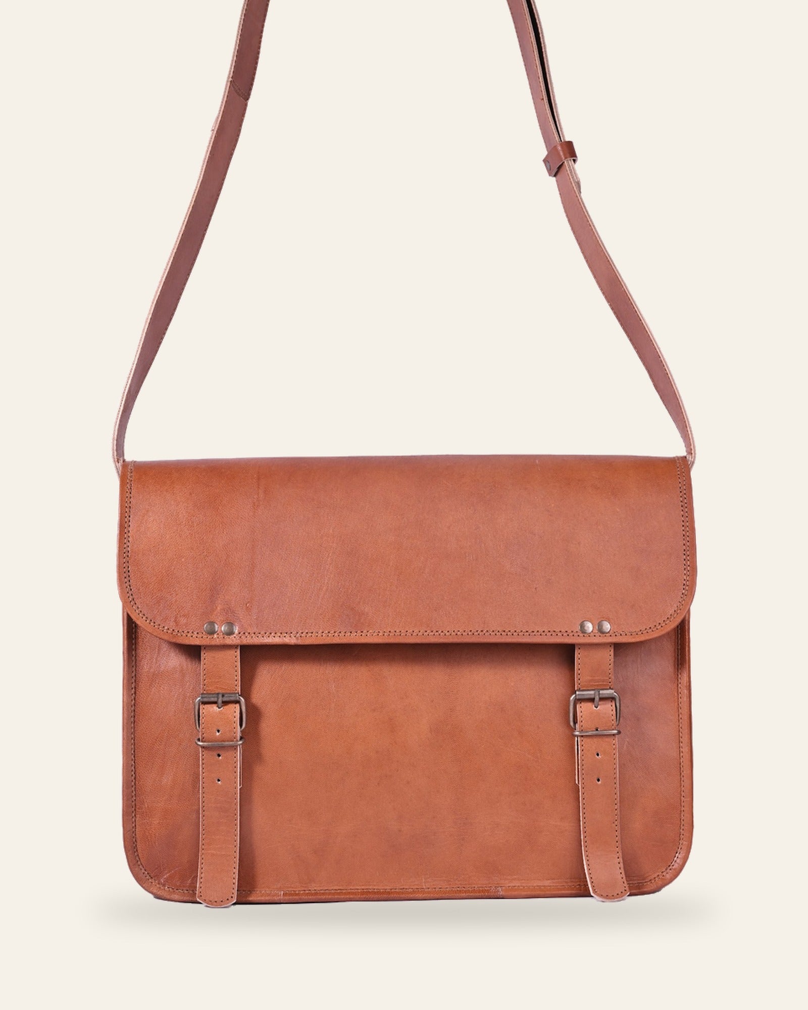 The Umaid Briefcase 13-14 in — handcrafted tan real leather laptop briefcase with twin buckle straps, front view