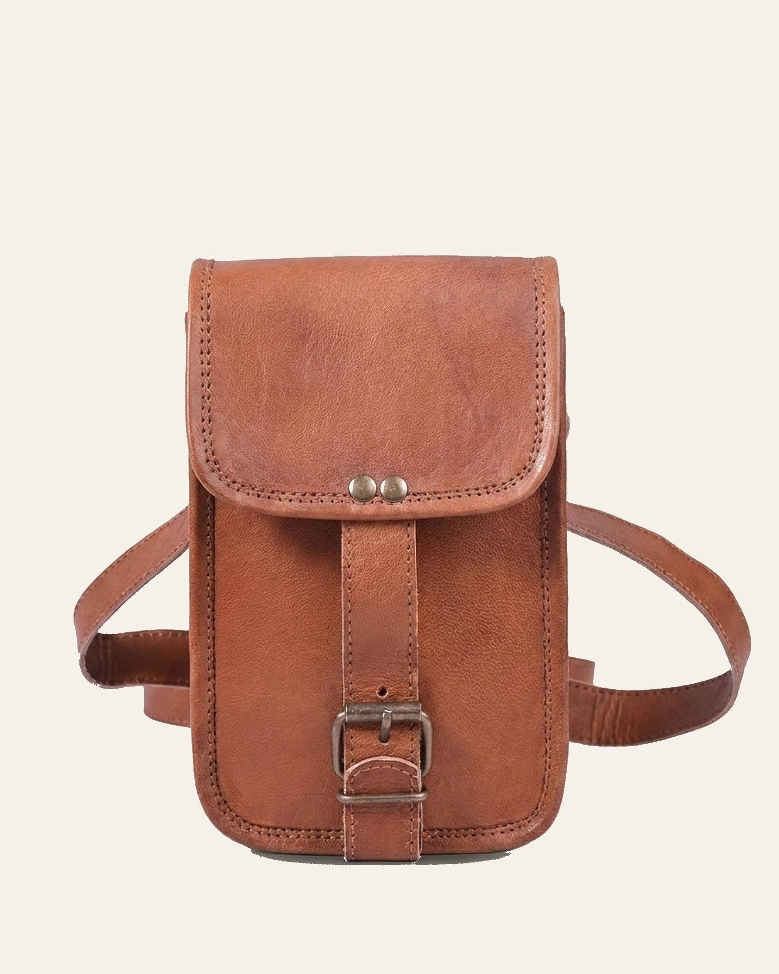 The Merta Mobile Sling in natural leather — front with buckle closure