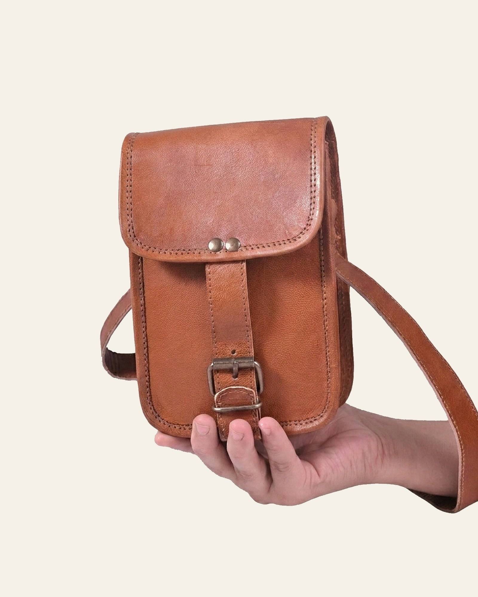 The Merta Mobile Sling — held in hand for scale
