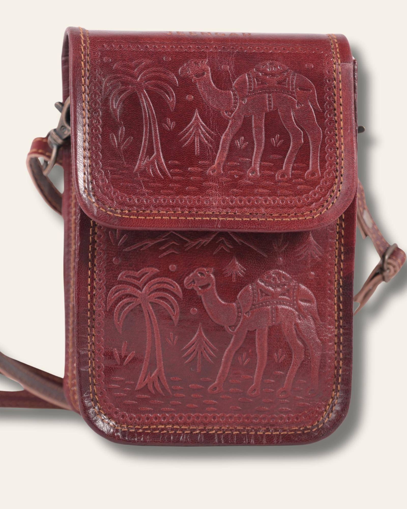 The Nagaur Sling in Cherry — hand-embossed leather mobile sling, front view