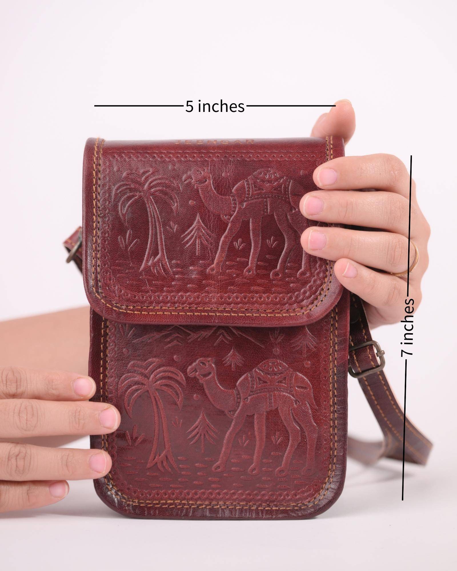 The Nagaur Sling in Cherry — embossed camel scene by artisan Mohan
