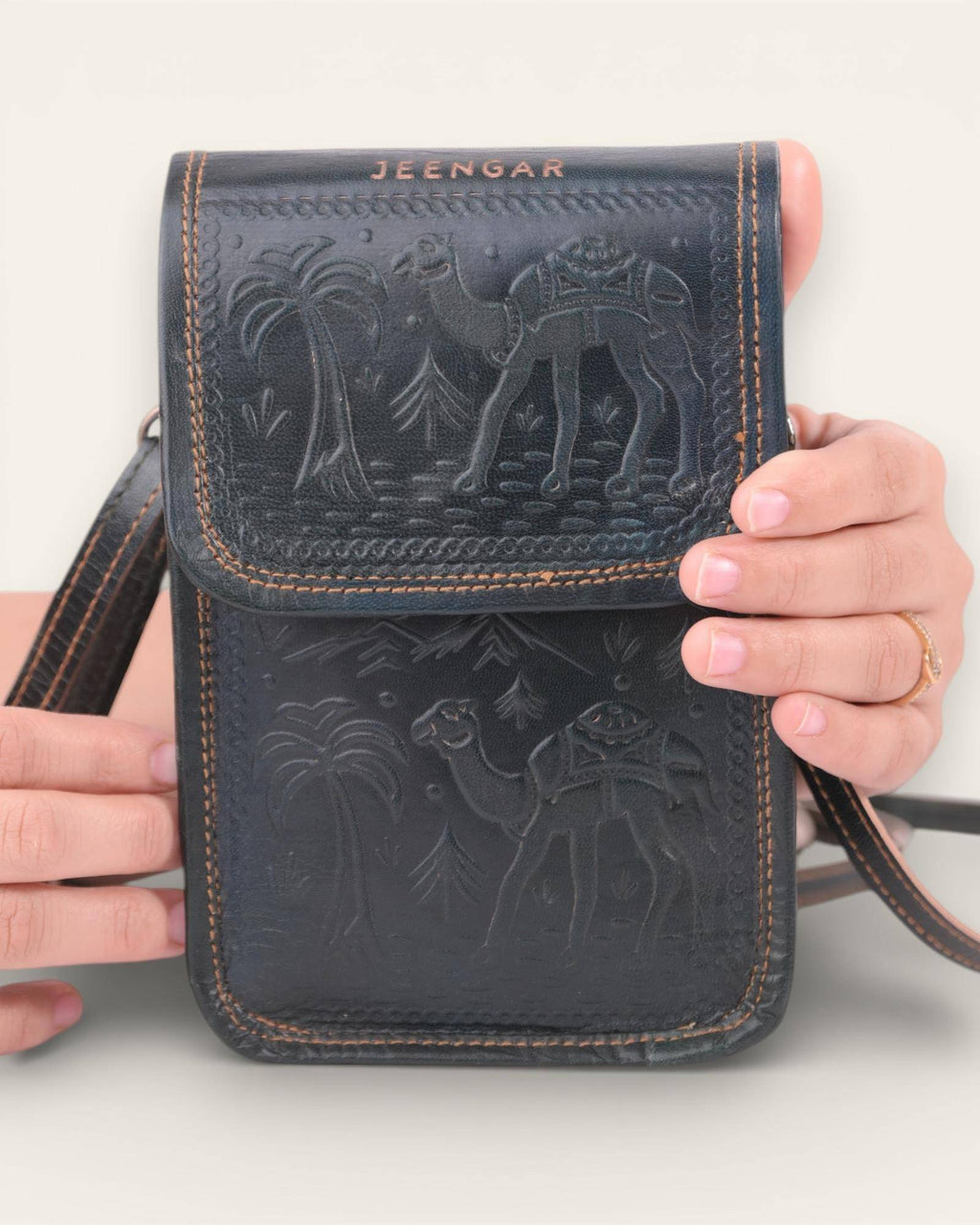 The Nagaur Sling in Dark Olive — embossed camel scene by artisan Mohan