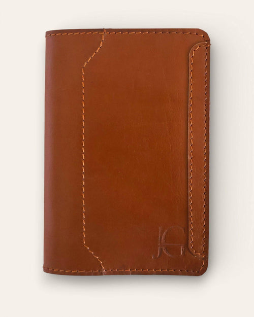 The Banjara Passport Holder — handcrafted tan leather passport cover by Jeengar, front view