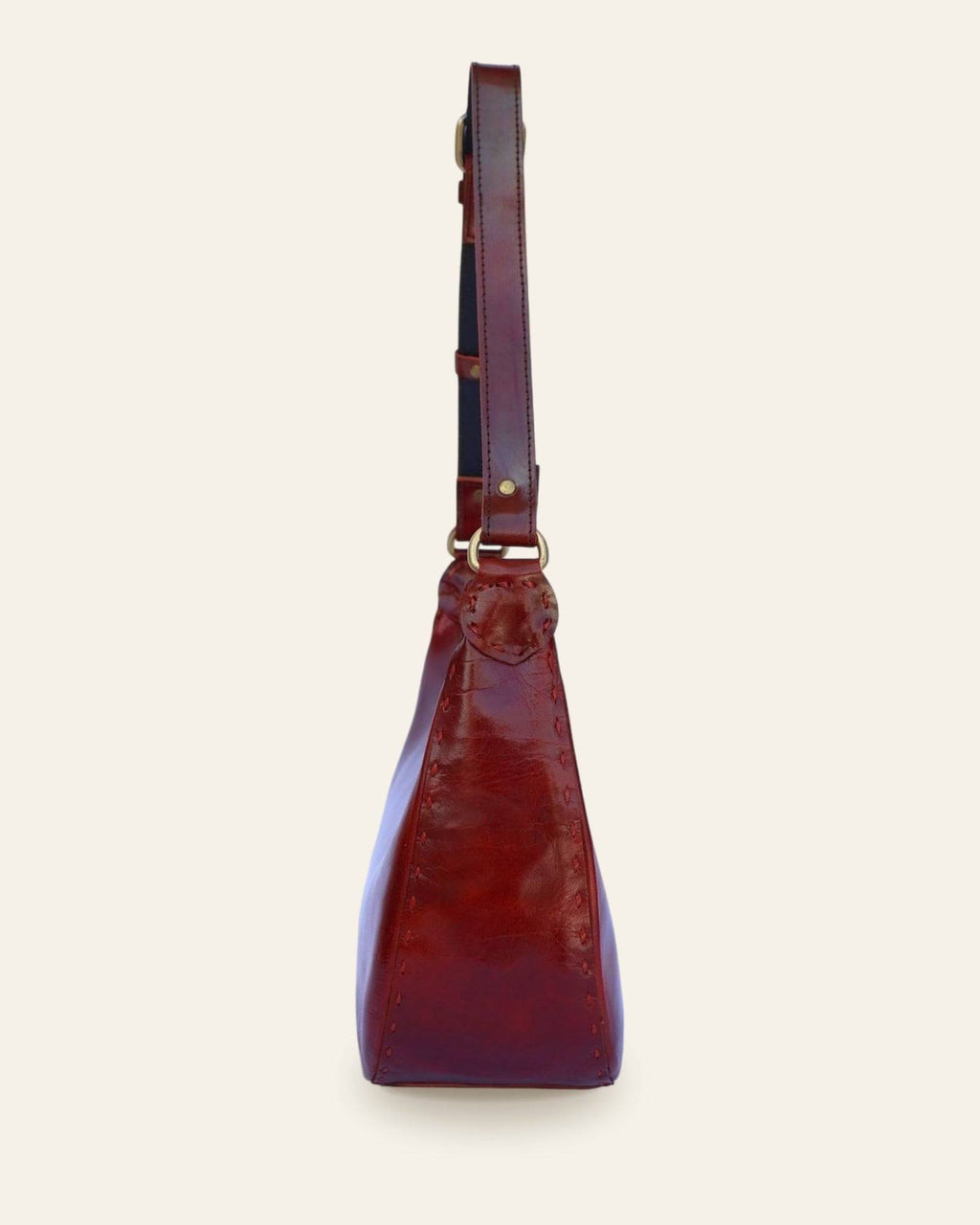 The Ranisar Shoulder Bag in Cherry — side profile