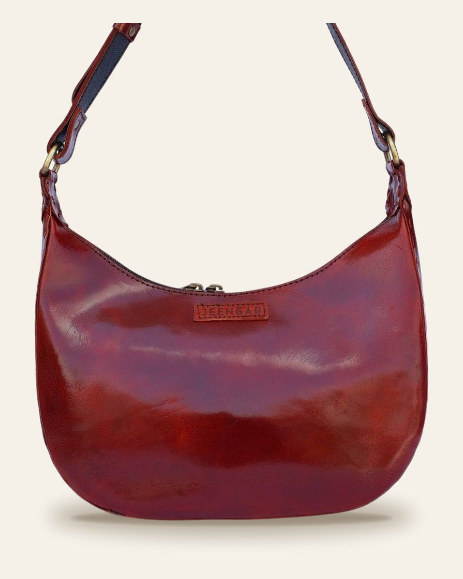 The Ranisar Shoulder Bag in Cherry — three-quarter view