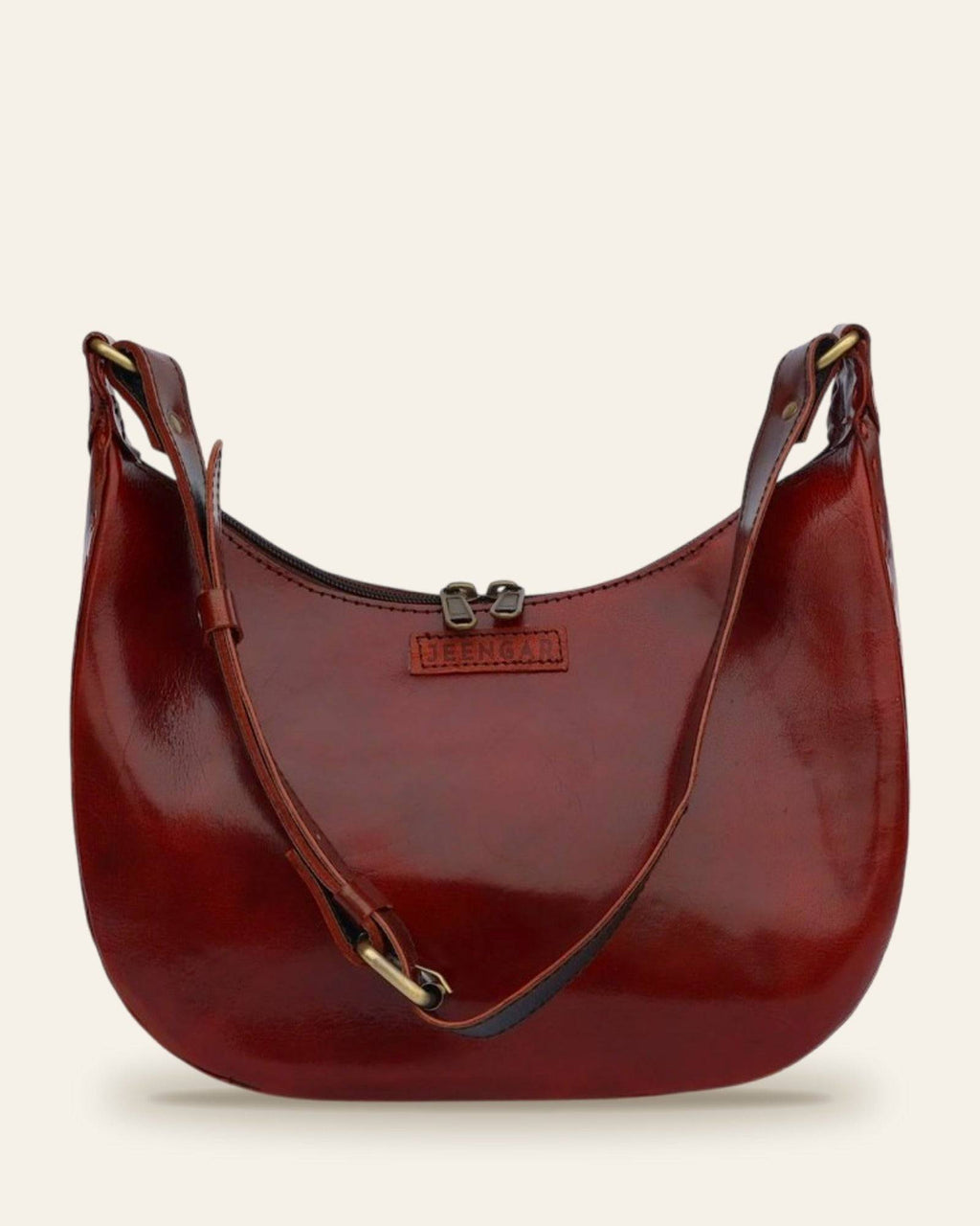The Ranisar Shoulder Bag in Cherry — full curved hobo silhouette with draped strap